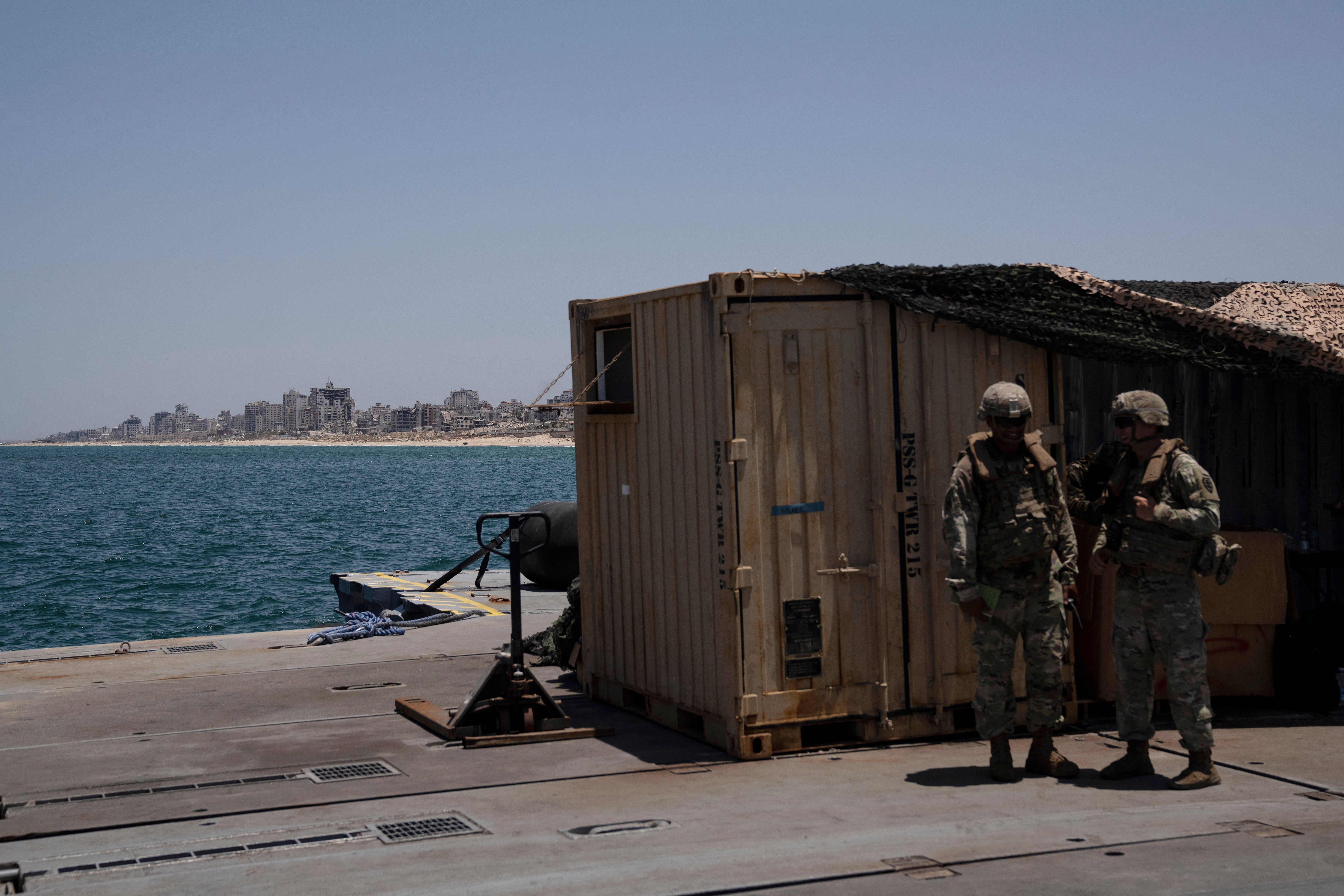 US soldiers stand at the floating pier off the coast of Gaza, which was dismantled after 20 days in operation last year