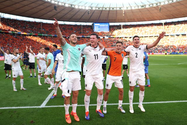 <p>Austria celebrate after beating the Netherlands to top the group </p>