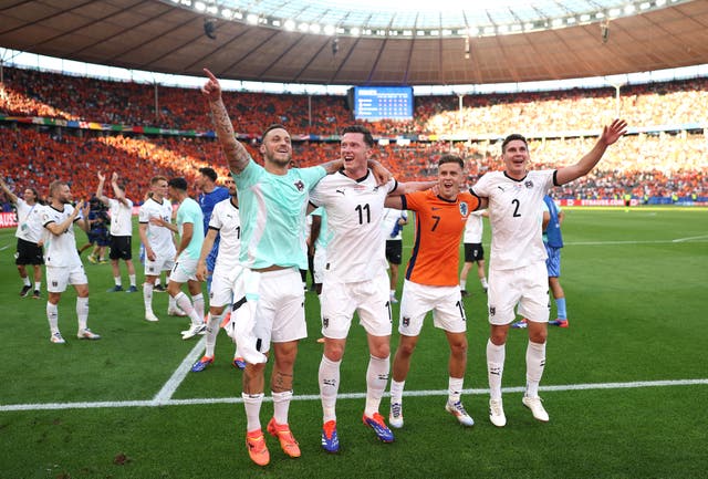 <p>Austria celebrate after beating the Netherlands to top the group </p>