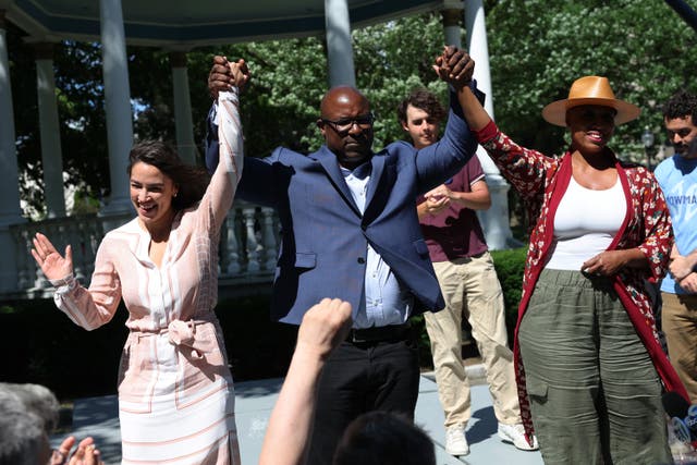 <p>Rep. Alexandria Ocasio-Cortez (D-NY), Rep. Jamaal Bowman (D-NY) and Rep. Ayanna Pressley (D-MA) raise their hands during a Get Out the Vote campaign event at Hartley Park . Bowman survived a grueling primary against George Latimer. </p>
