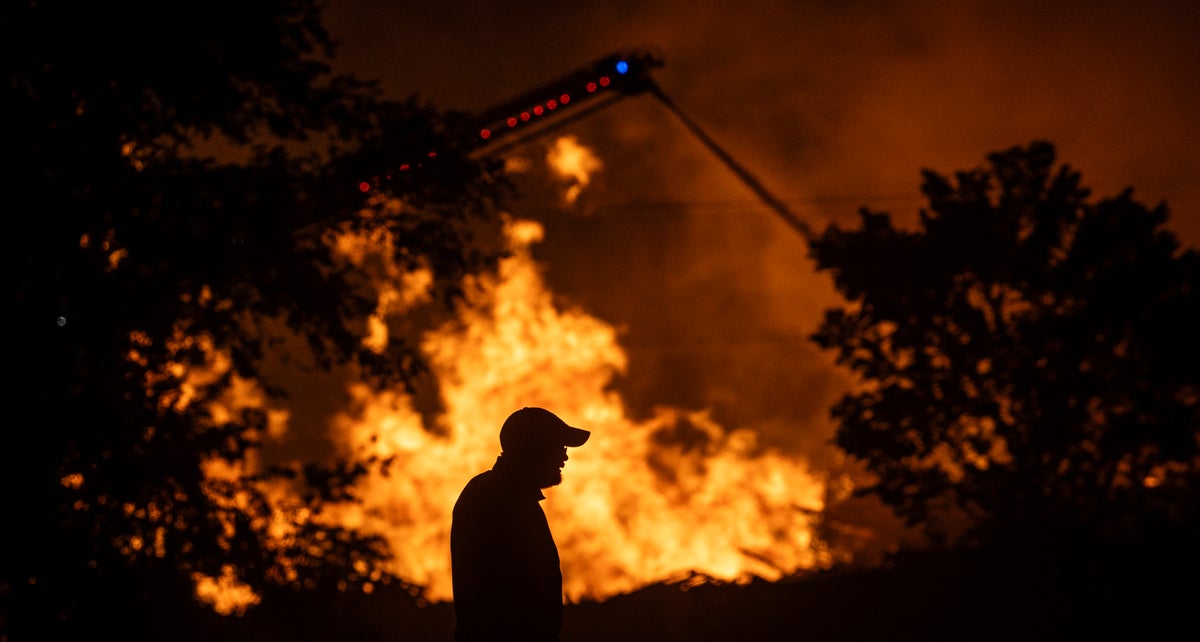 Kansas official hopeful that fire crews can control a blaze at a recycling center