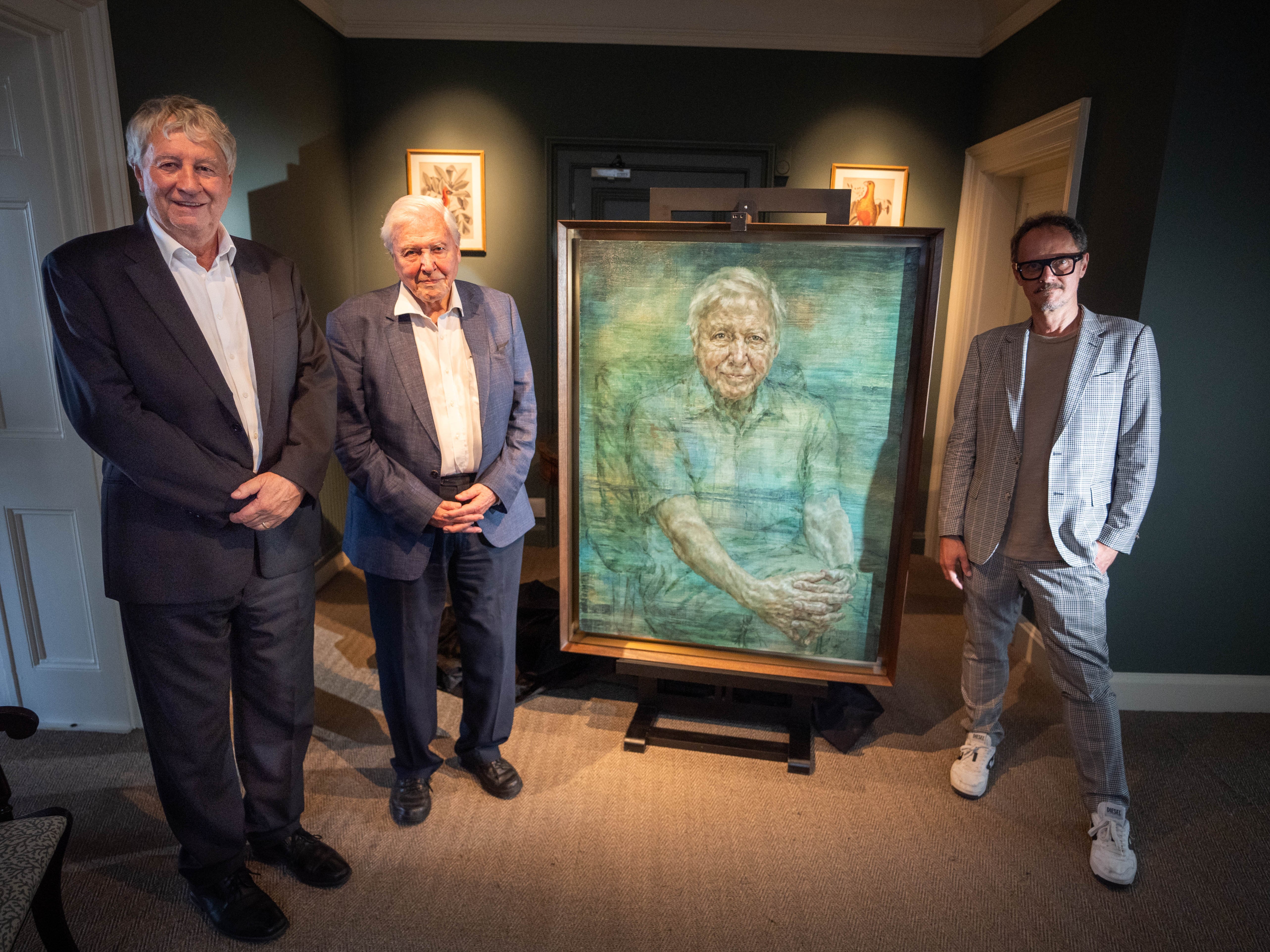 Royal Society President Adrian Smith, Sir David Attenborough and Jonathan Yeo during the unveiling of a portrait of the broadcaster and conservationist