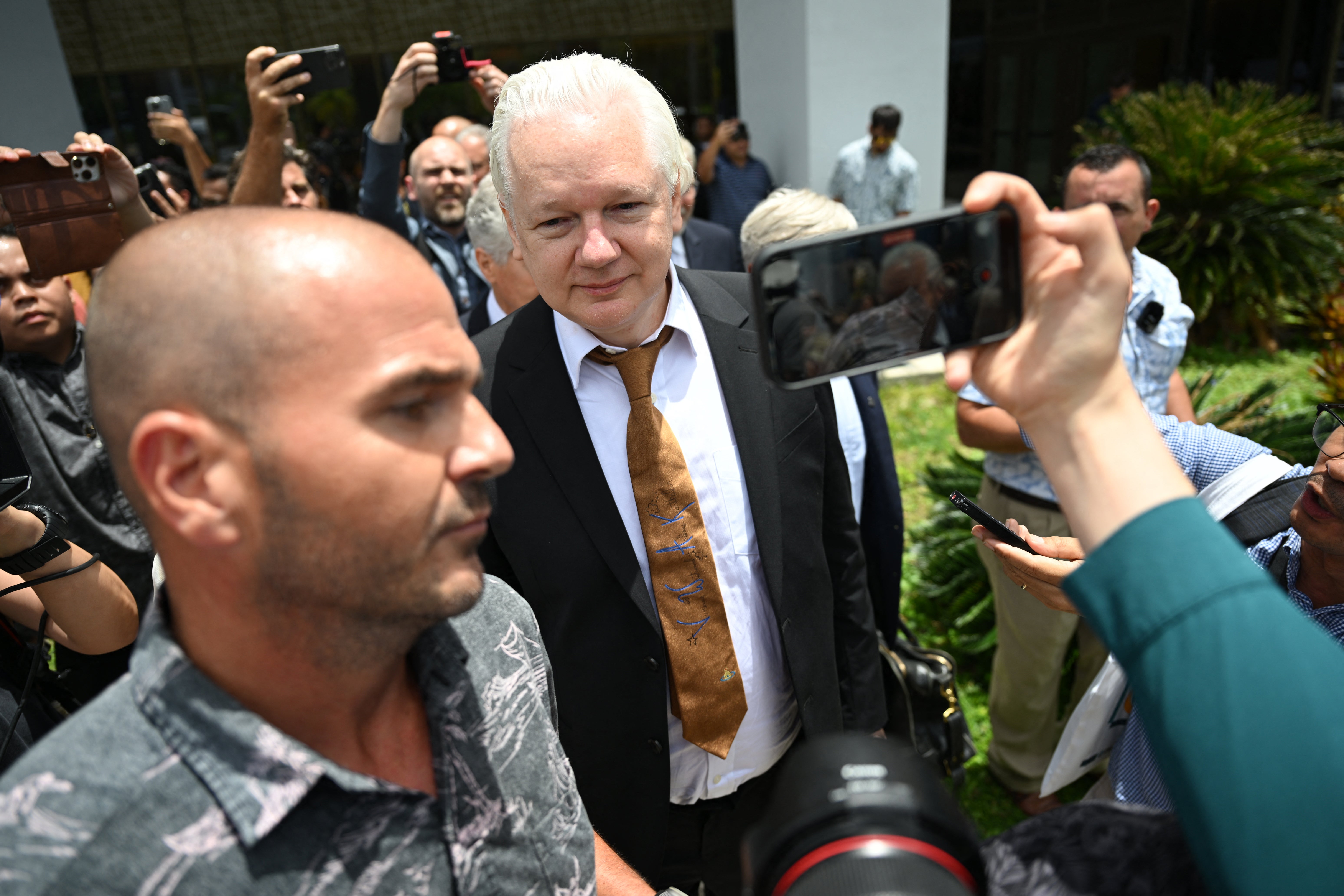 WikiLeaks founder Julian Assange leaves the US Federal Courthouse in the Commonwealth of the Northern Mariana Islands in Saipan, Northern Mariana Islands, on June 26, 2024, after pleading guilty to a single count of conspiracy