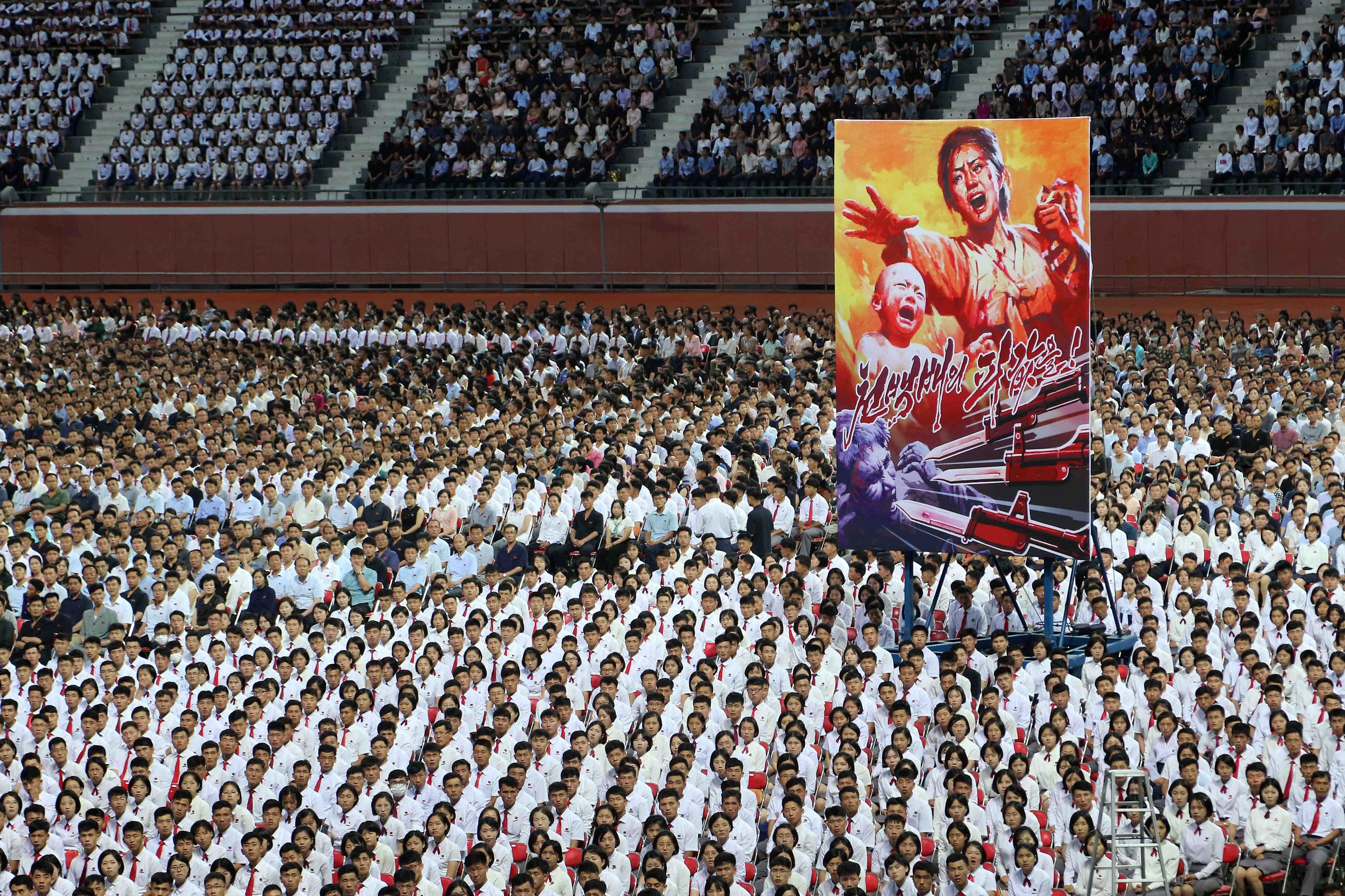 People take part in a mass rally to mark what North Korea calls "the day of struggle against U.S. imperialism" at the May Day Stadium in Pyongyang, North Korea Tuesday