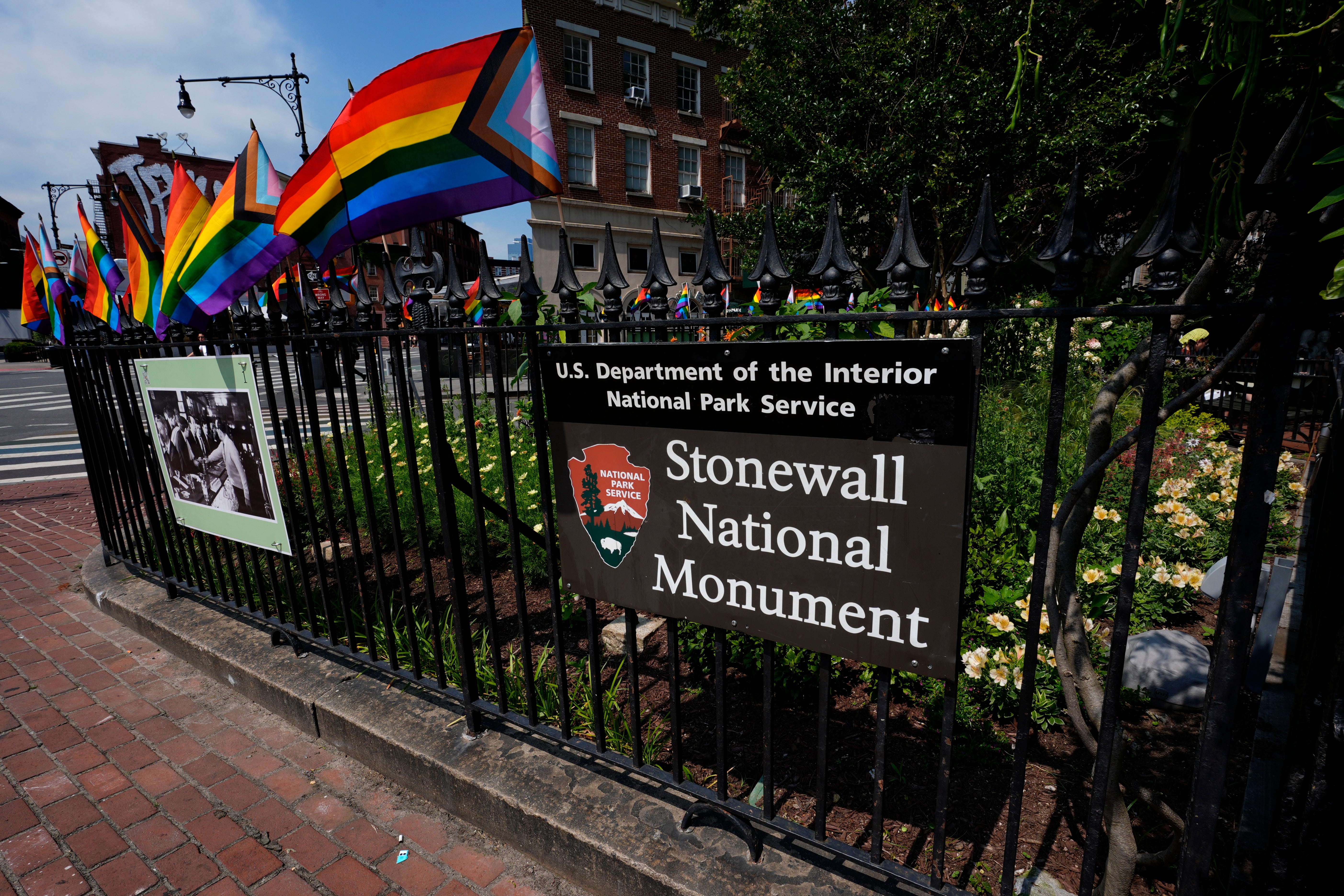 A National Park Service sign marks the Stonewall National Monument outside the Stonewall Inn, Monday, June 17, 2024, in New York. The building will open as the new visitor center for the Stonewall National Monument on Friday, June 28, the anniversary of the 1969 rebellion that helped reshape LGBTQ+ life in the US