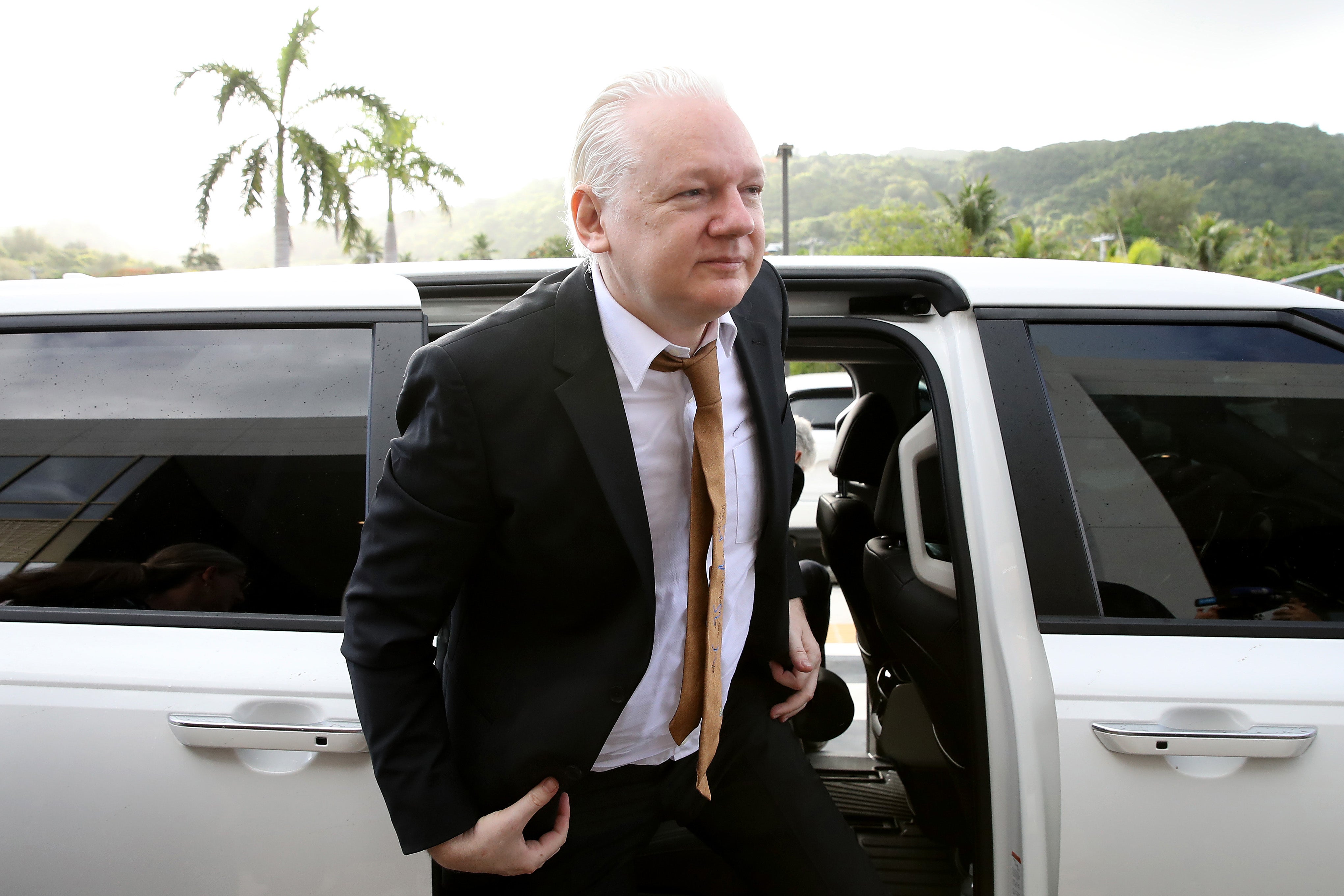 WikiLeaks founder Julian Assange arrives at the United States Courthouse in Saipan where he entered a guilty plea to an espionage charge in a deal for his release