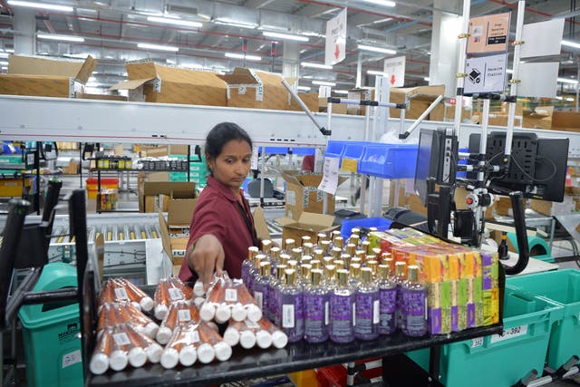 <p>An Amazon employee at Amazon’s fulfilment centre in Bengaluru</p>