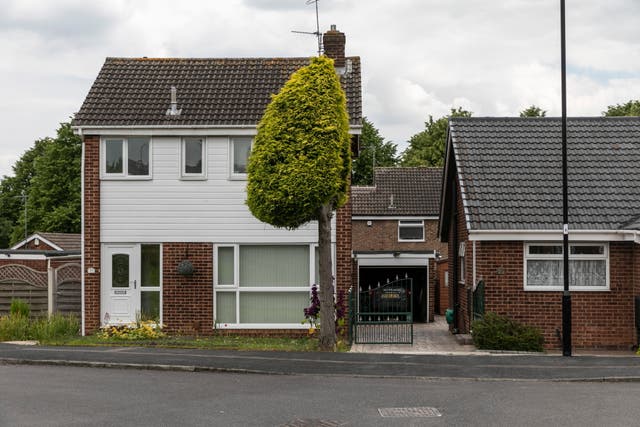 <p>Neighbours who split their tree in three two years ago are still no speaking due to the initial row, pictured in Waterthorpe, Sheffield</p>