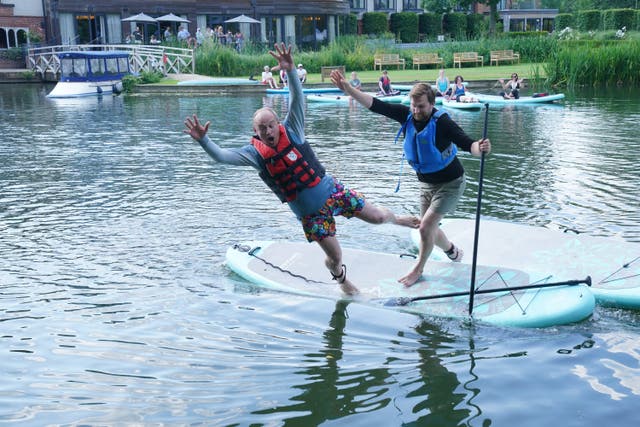 <p>Liberal Democrat leader Sir Ed Davey falls off a paddleboard during his visit to Streatley, Berkshire, while on the General Election campaign trail (Jonathan Brady/PA)</p>