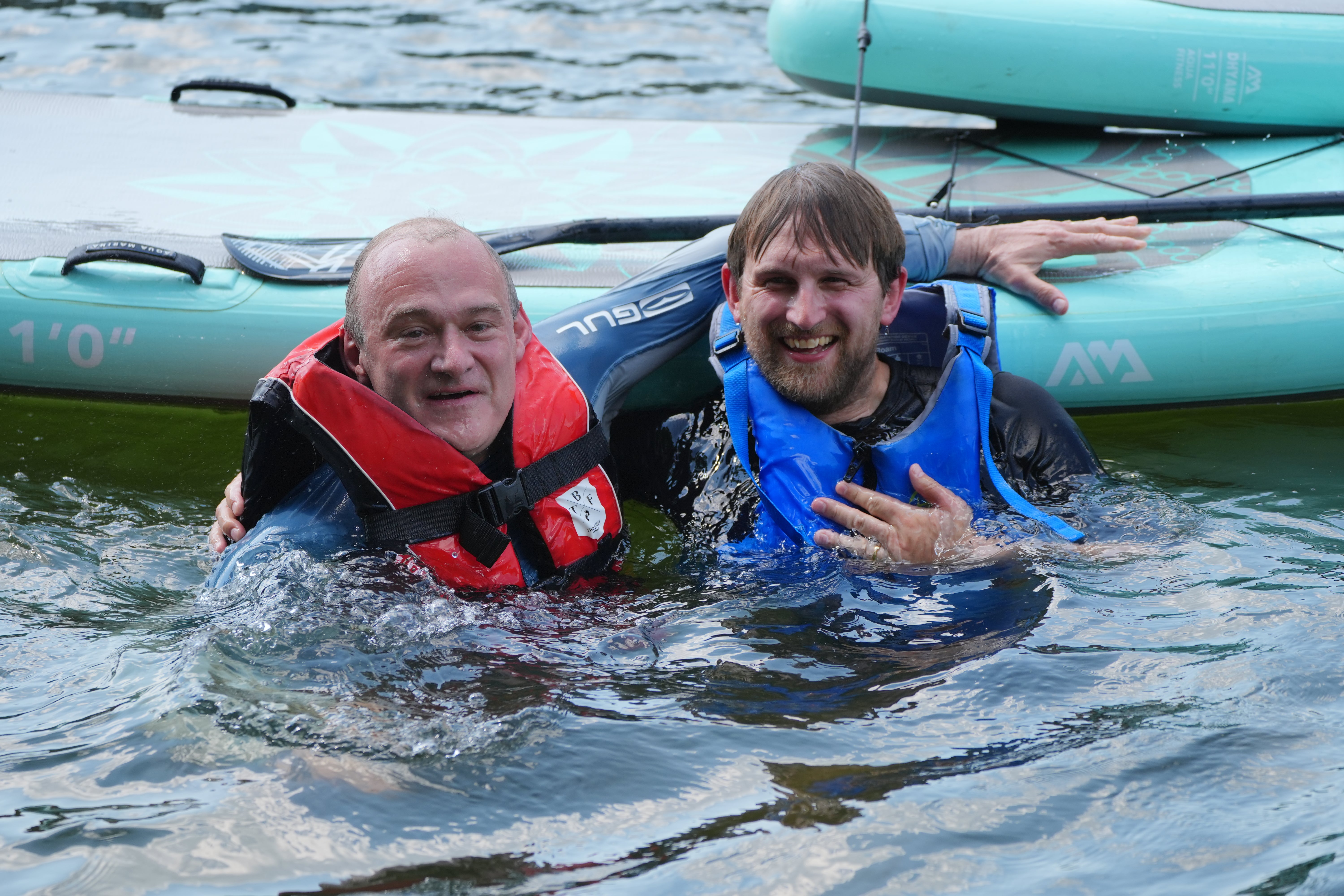 Liberal Democrat leader Sir Ed Davey (left) and local parliamentary candidate Freddie van Mierlo after falling off their paddleboards