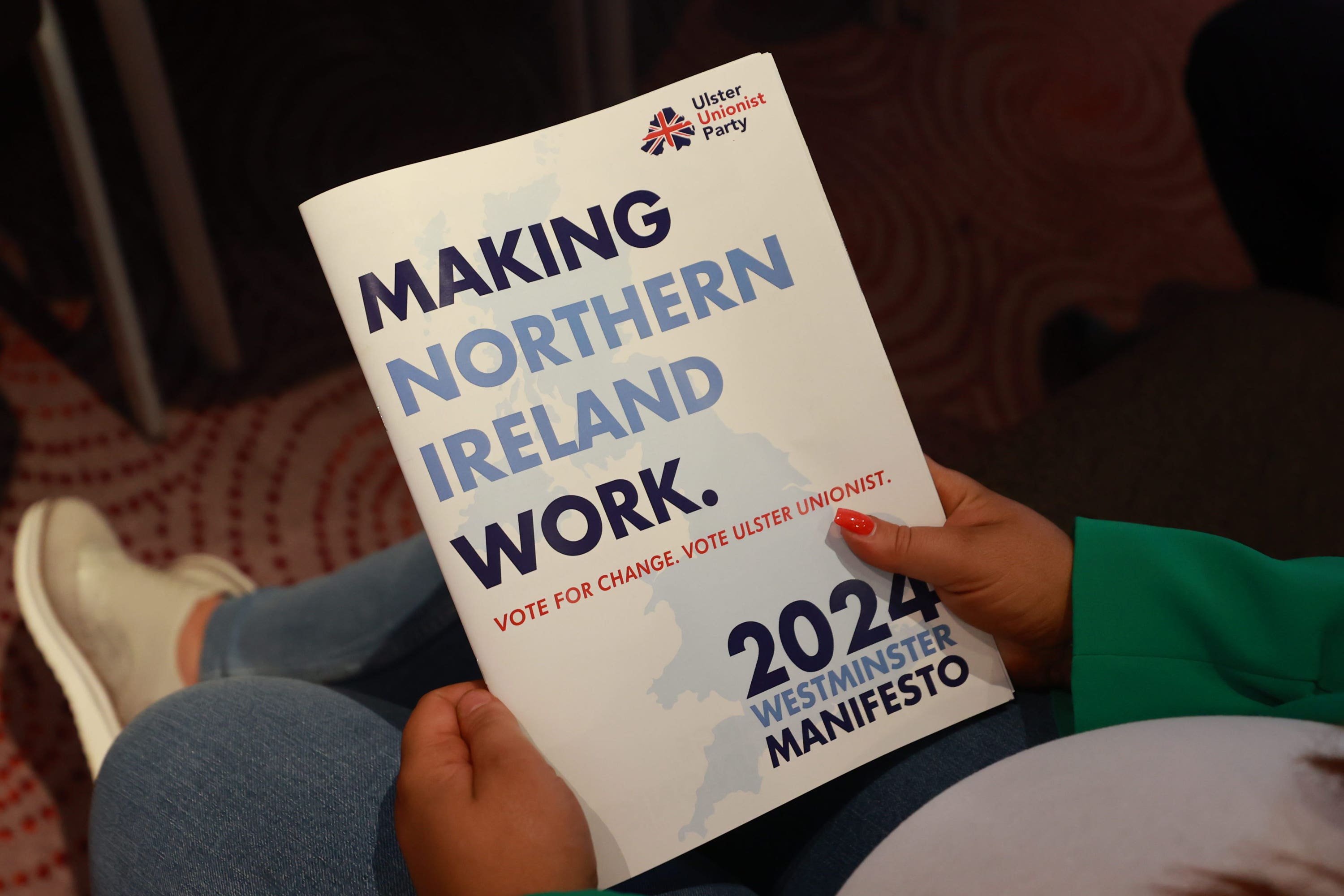 A party supporter holds the UUP manifesto at the Stormont Hotel in Belfast (Liam McBurney/PA)