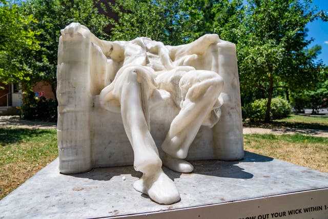 <p> A wax replica of the Lincoln Memorial statue has melted during a heat wave in Washington, DC, on June 24, 2024. The statue is a part of the The Wax Monument Series by Virginia based artist Sandy Williams IV</p>
