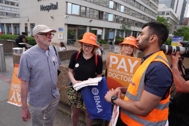 <p>Jeremy Corbyn (left) joins junior doctors on the picket line outside St Thomas’ Hospital, London, during their latest five-day strike over pay demands </p>