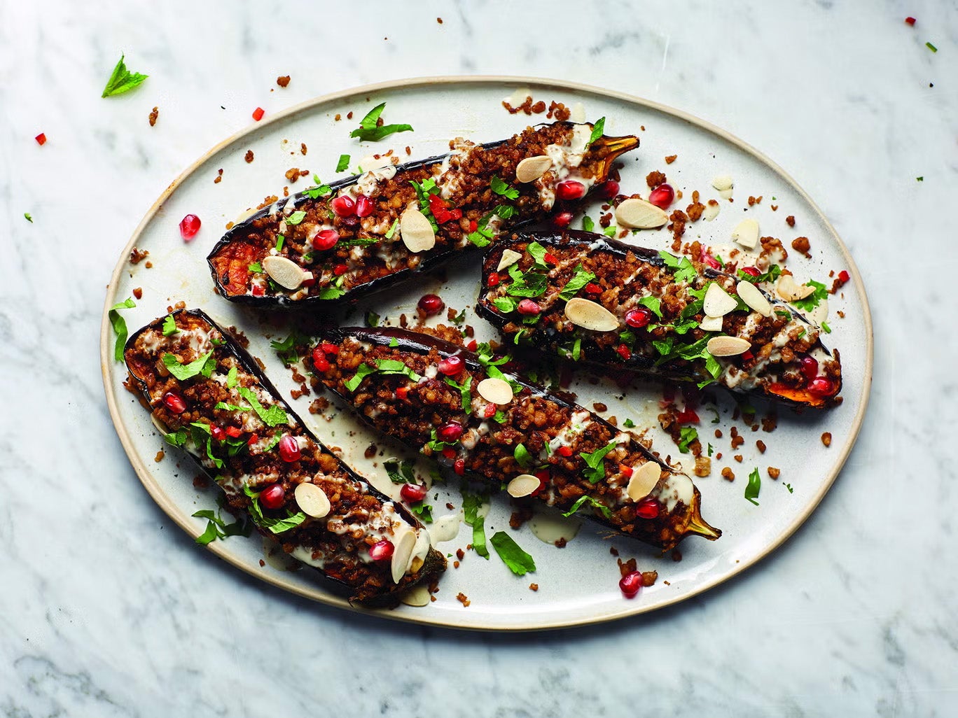 This spicy stuffed aubergine recipe comes packed with flavour – and a fascinating backstory
