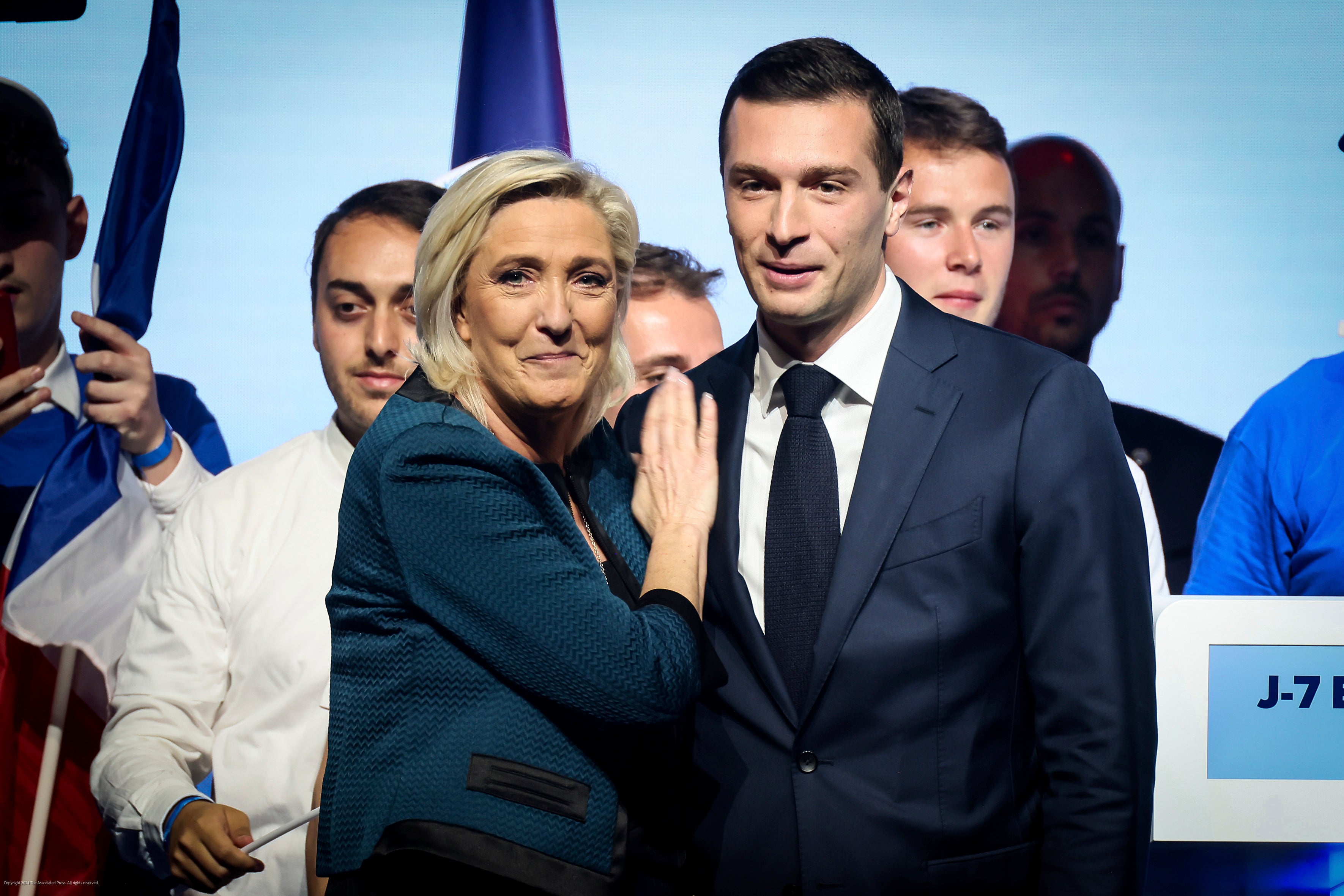 Leader of the French far-right National Rally Marine Le Pen, left and lead candidate of the party for the upcoming European election Jordan Bardella during a political meeting on June 2, 2024 in Paris