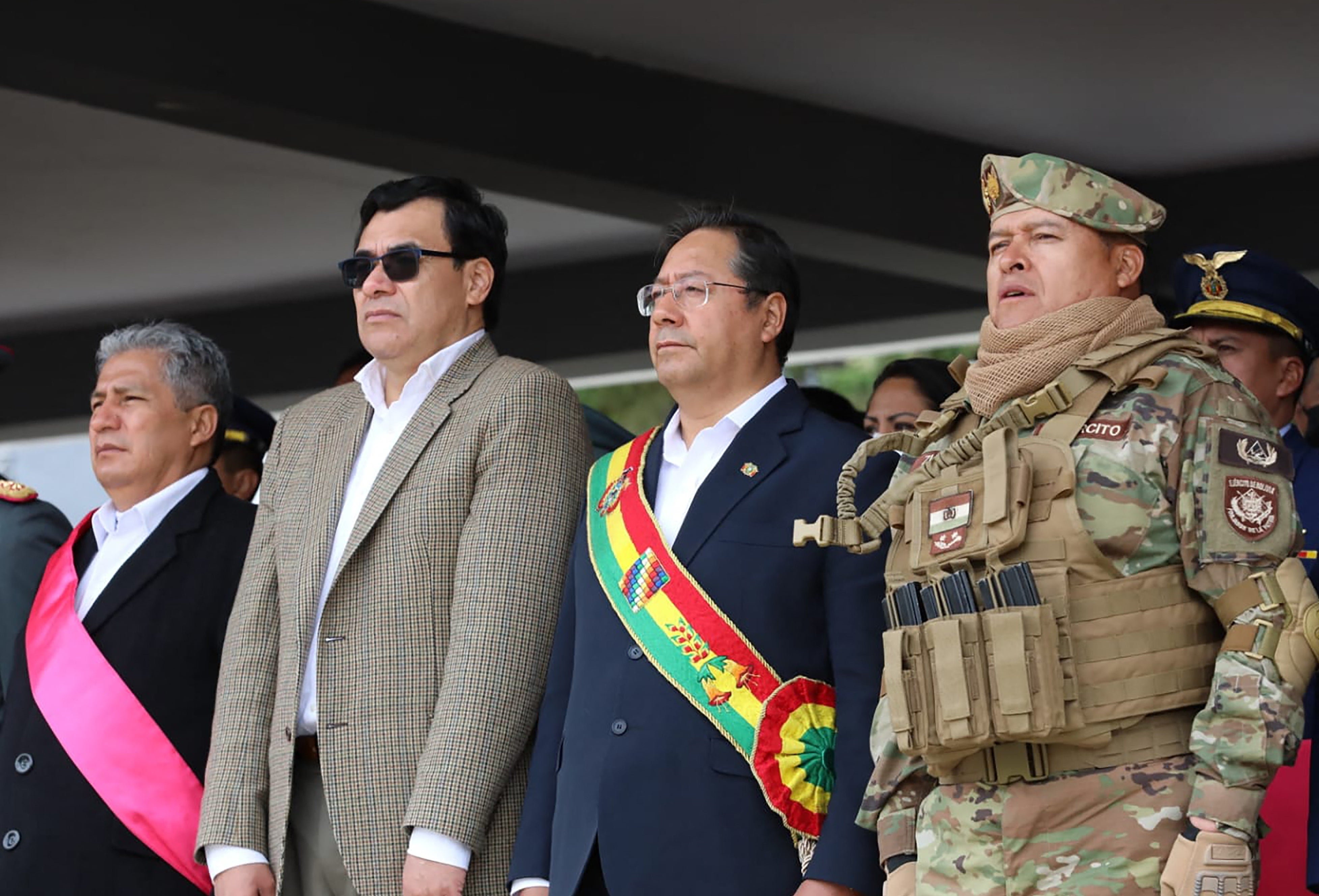 In this handout picture released by Bolivian Presidency, Bolivian President Luis Arce (2nd R) attend a Military event next to Gen. Juan Jose Zuniga (R) in La Paz on April 18, 2024