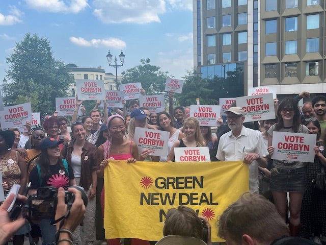 Jeremy Corbyn posing with activists from Green New Deal