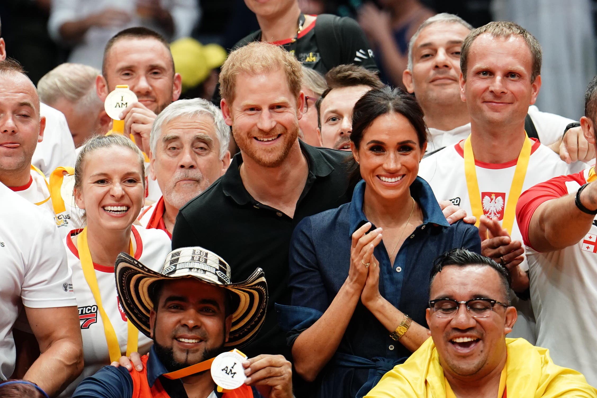 The Duke and Duchess of Sussex with medal winners during the Invictus Games in Dusseldorf, Germany (Jordan Pettitt/PA)