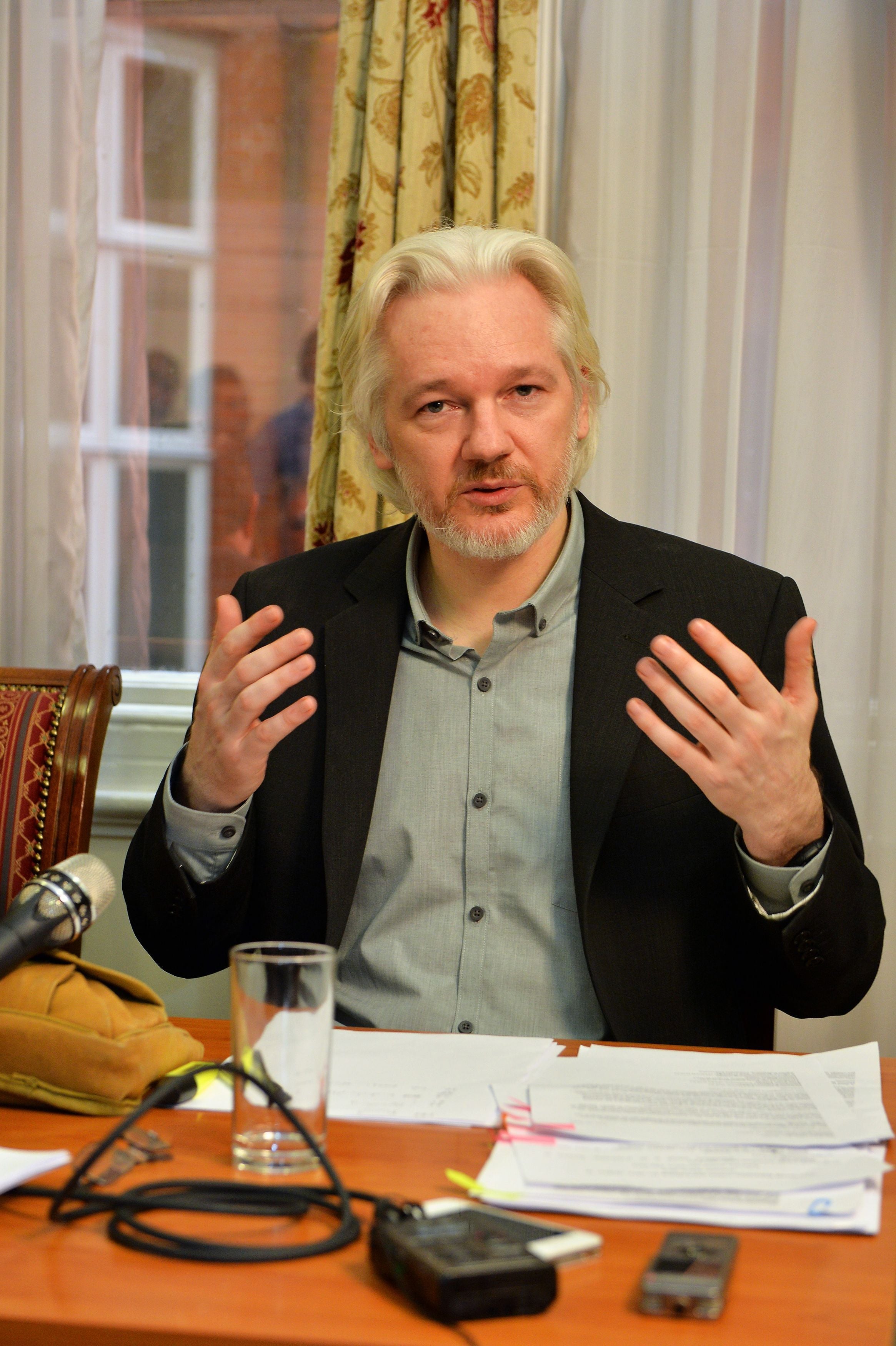 Julian Assange speaks during a press conference inside the Ecuadorian embassy in London (PA)