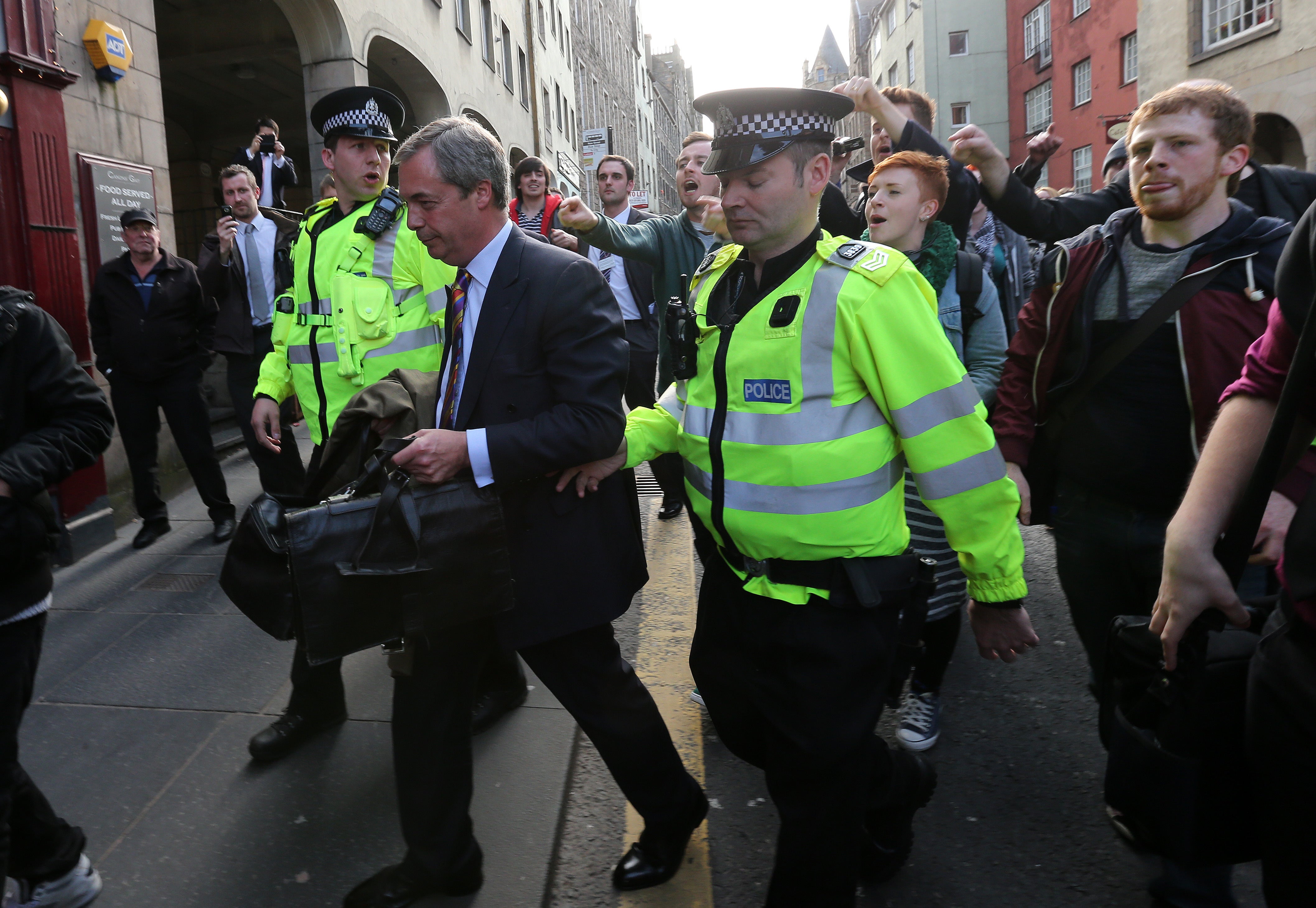 The then Ukip leader Nigel Farage had to be taken away in a police riot van after protestors gathered at a pub in Edinburgh where he hosted a press conference in 2013. (Andrew Milligan/PA)