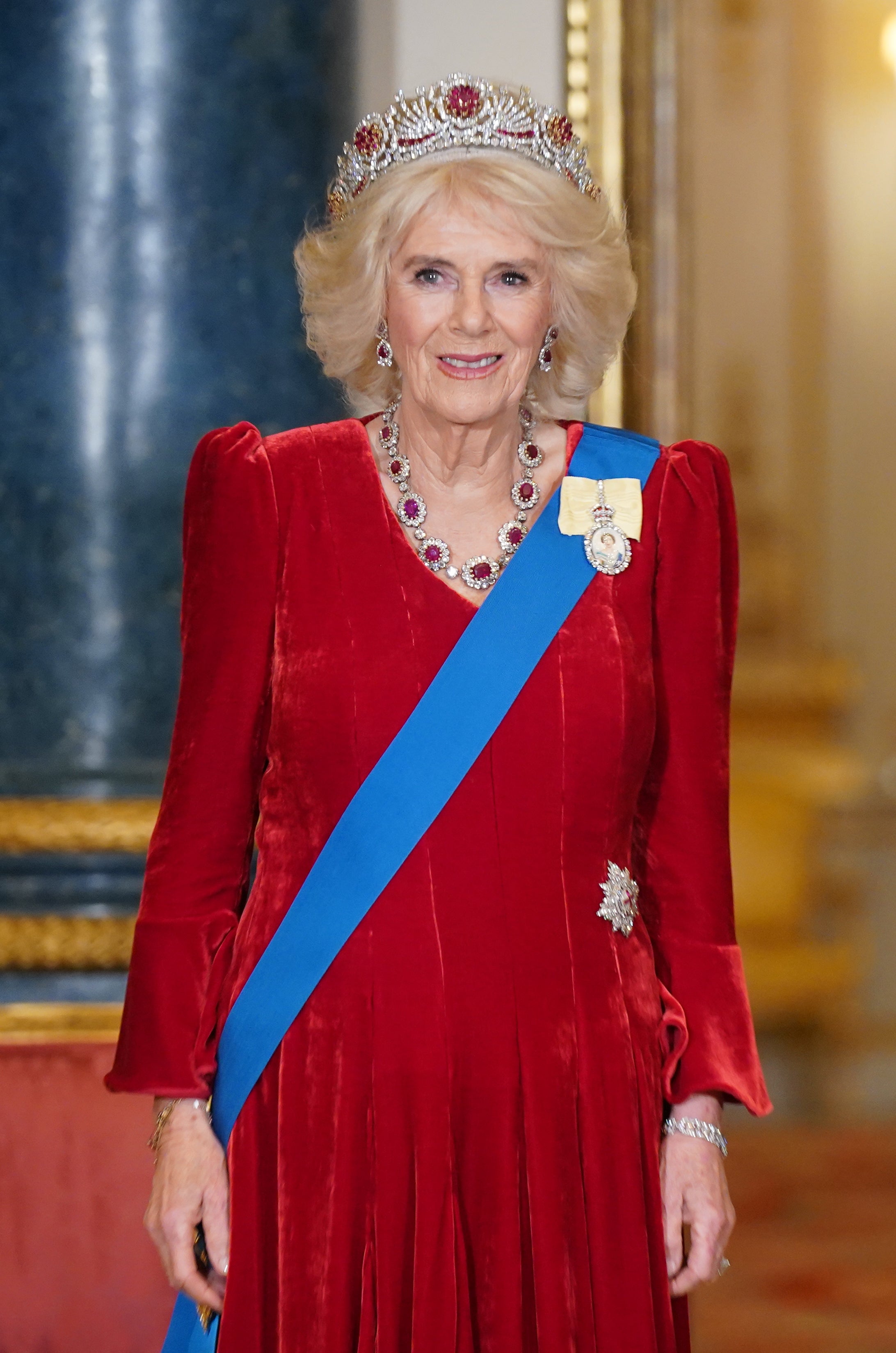 Queen Camilla wearing the late Queen’s yellow Family Order at a state banquet last November (Yui Mok/PA)