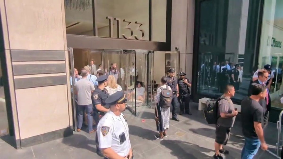 Climate protesters block entrance to Chubb office in Manhattan