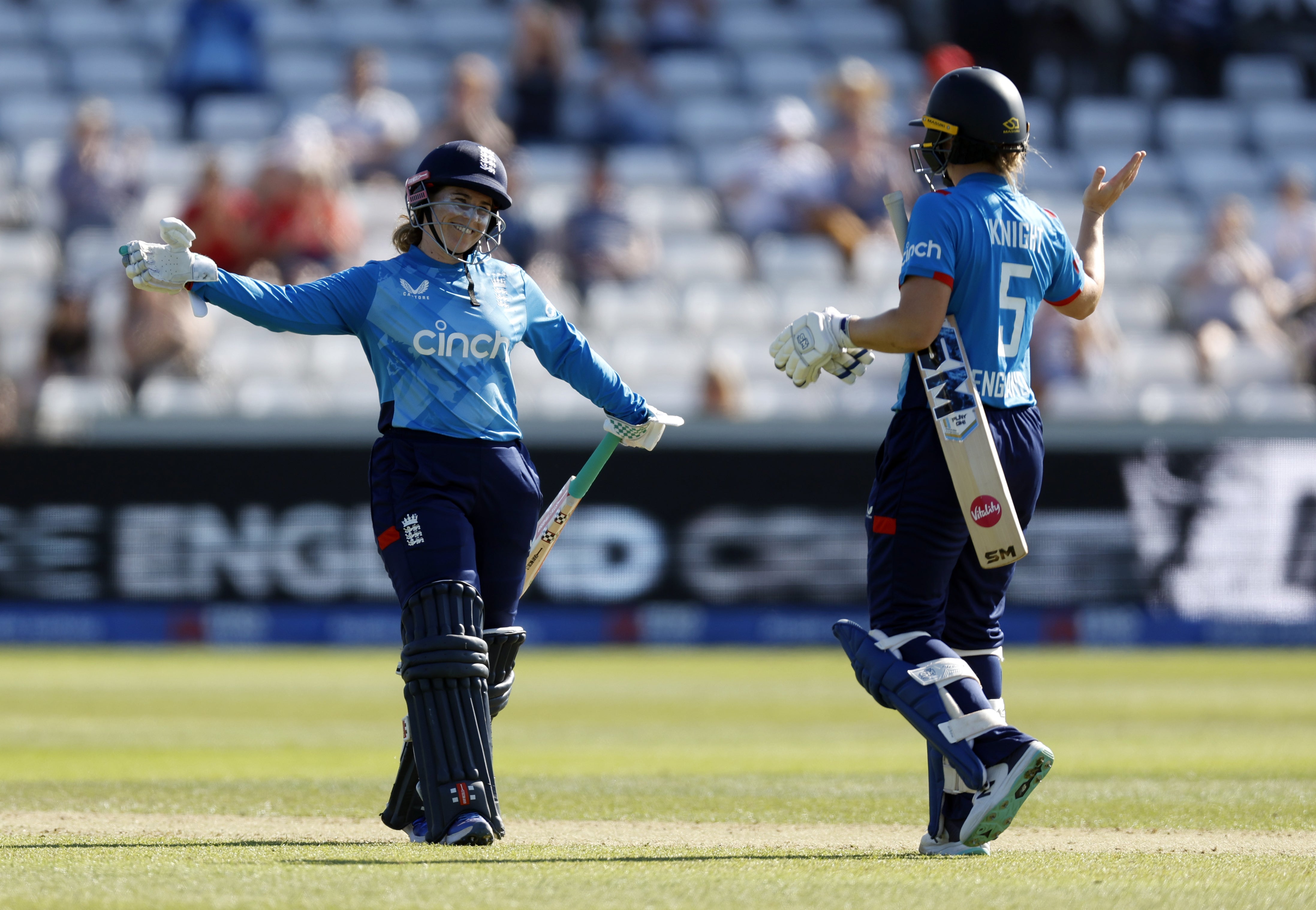 Tammy Beaumont and Heather Knight celebrate England’s victory at Chester-le-Street (Nigel French/PA)