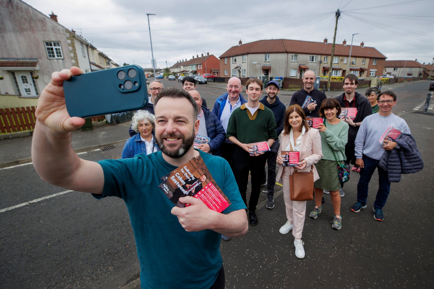 Colum Eastwood, SDLP leader and candidate for the party in the Westminster constituency of Foyle in Northern Ireland taking a selfie with his canvassing team in the Creggan area of Derry City. (Liam McBurney/PA)