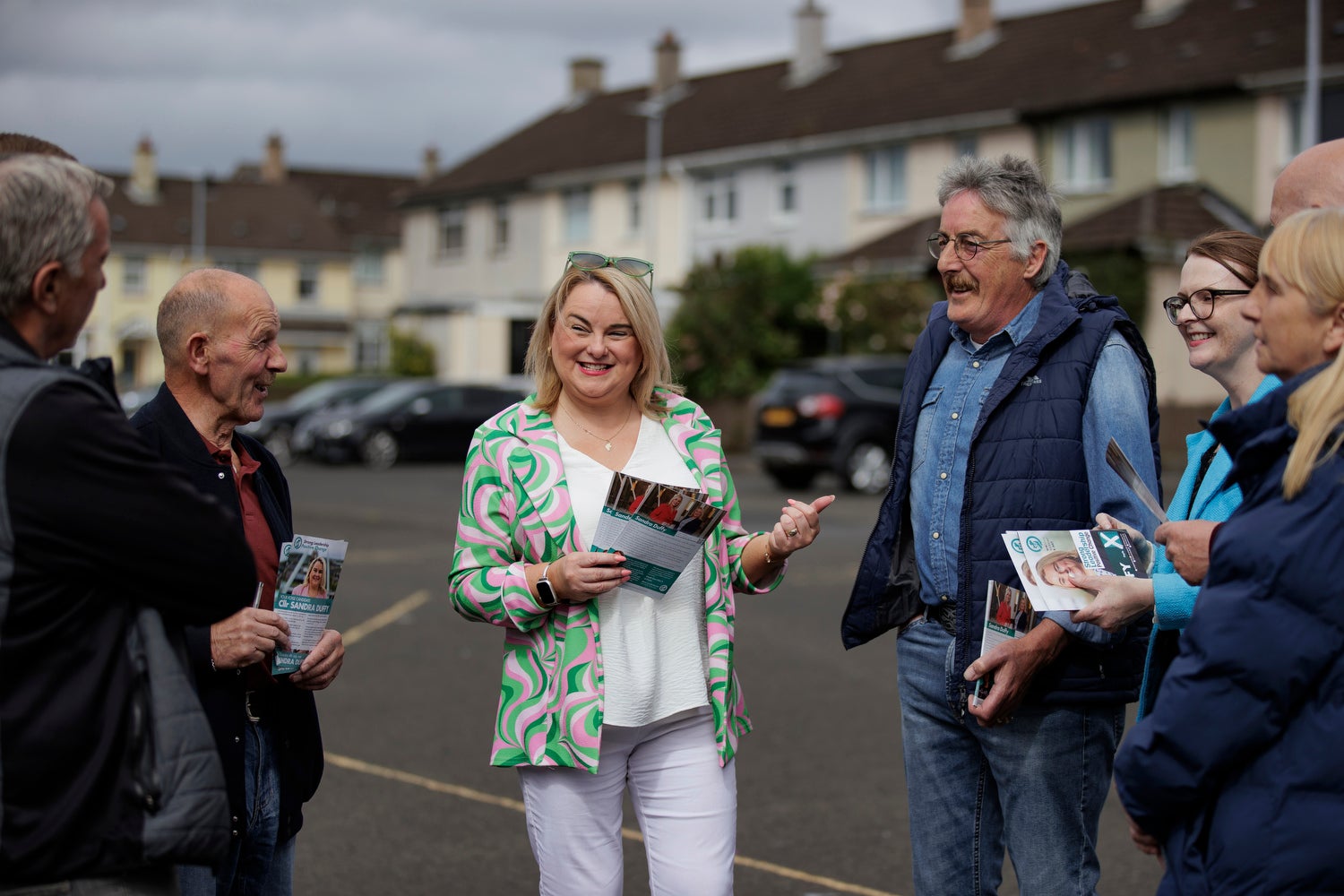 Sandra Duffy (centre), Sinn Fein candidate in the Westminster constituency of Foyle in Northern Ireland, speaking with her canvassing team in the Shantallow area of Derry City. Picture date: Thursday June 20, 2024. PA Photo. See PA story POLITICS Election Foyle. Photo credit should read: Liam McBurney/PA Wire