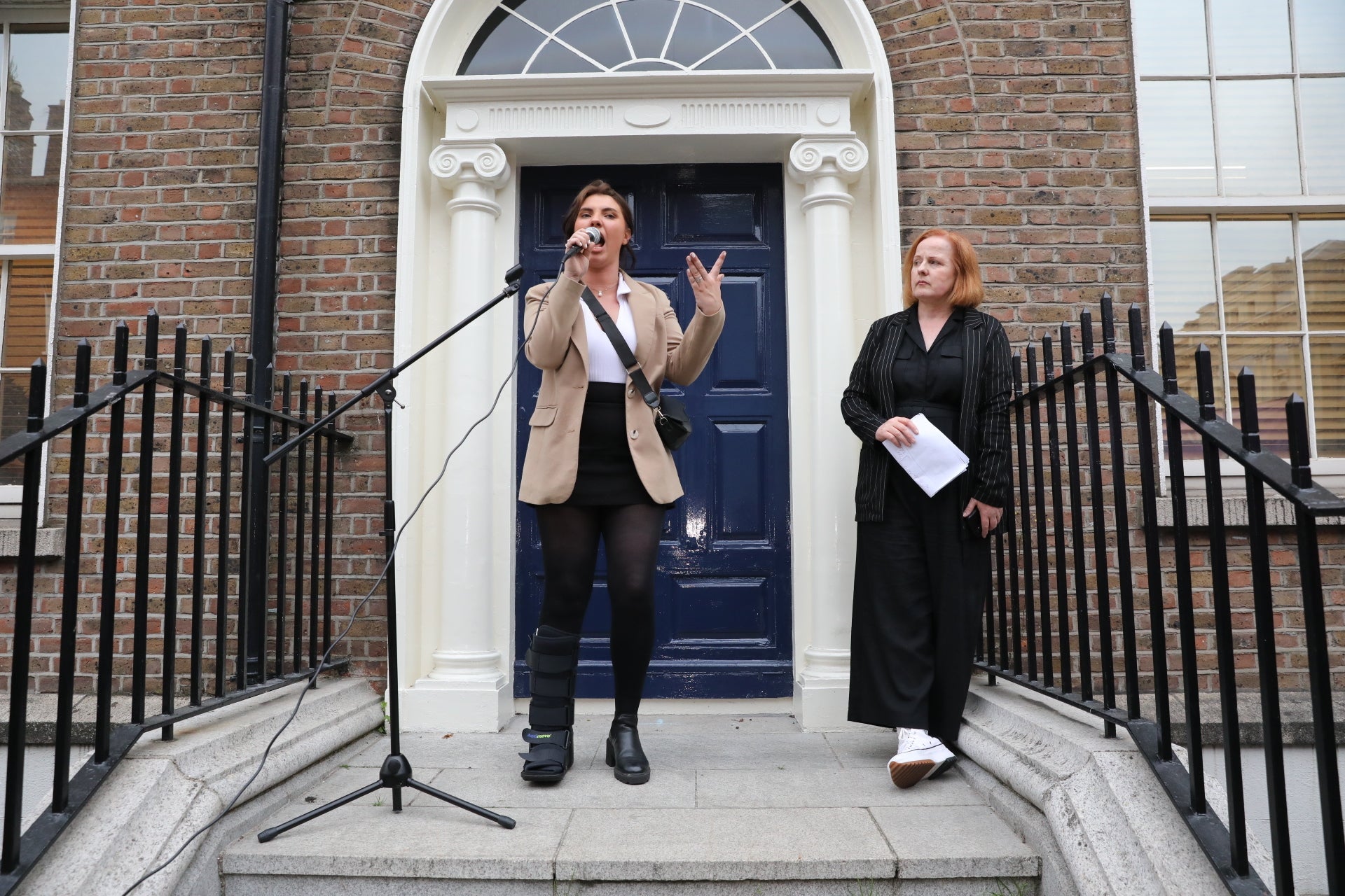Natasha O’Brien (left) addresses protesters outside Leinster House in Dublin (Gareth Chaney/PA)