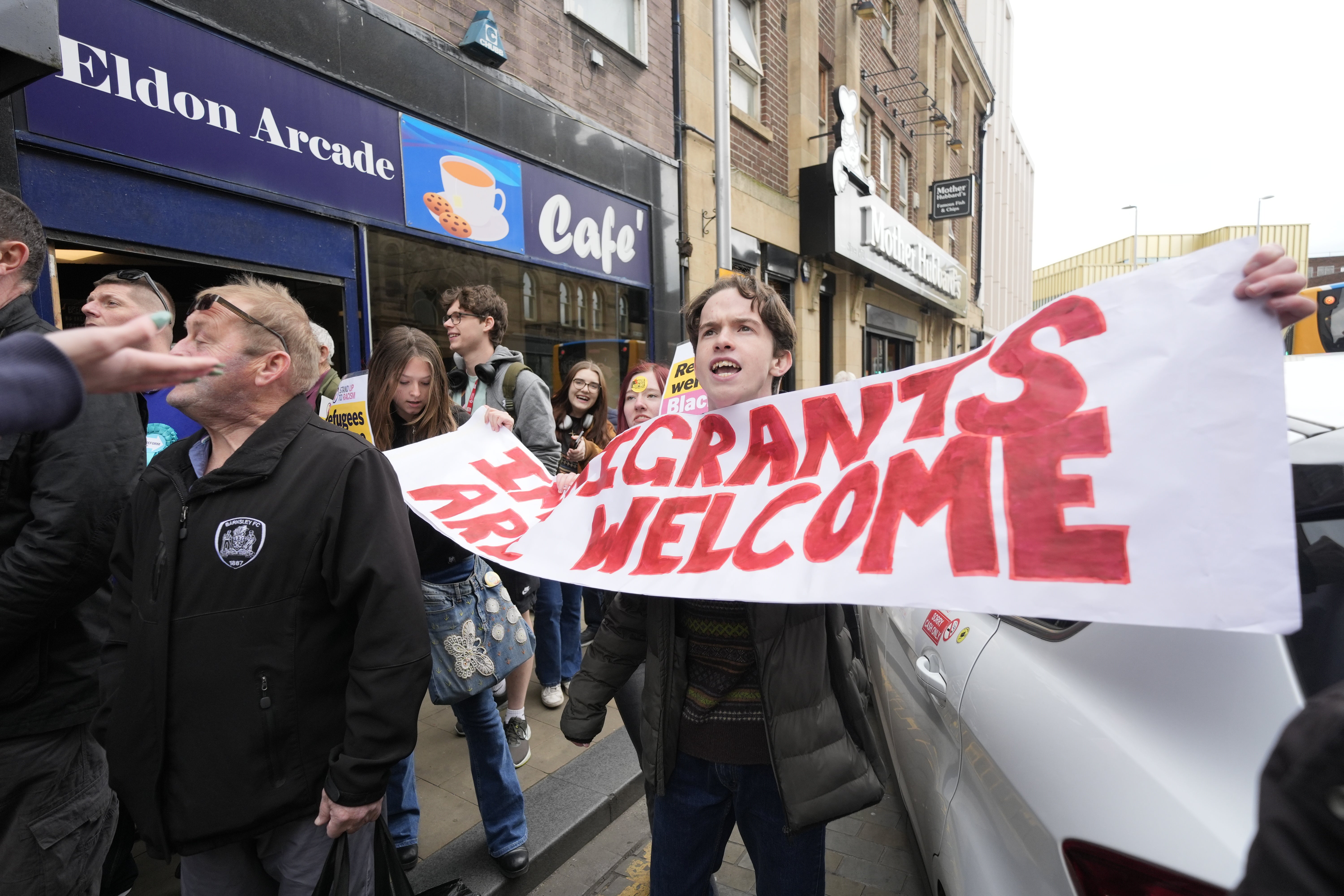 Protests during Nigel Farage’s visit to Barnsley (Danny Lawson/PA)