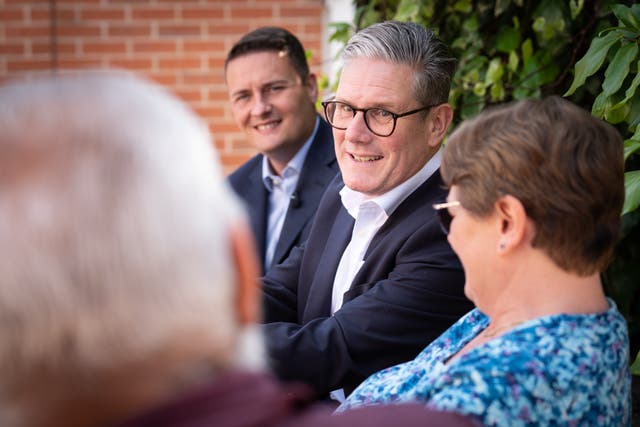 <p>Sir Keir Starmer and shadow health secretary Wes Streeting chat to patients at the Long Lane Surgery in Coalville, East Midlands (Stefan Rousseau/PA)</p>