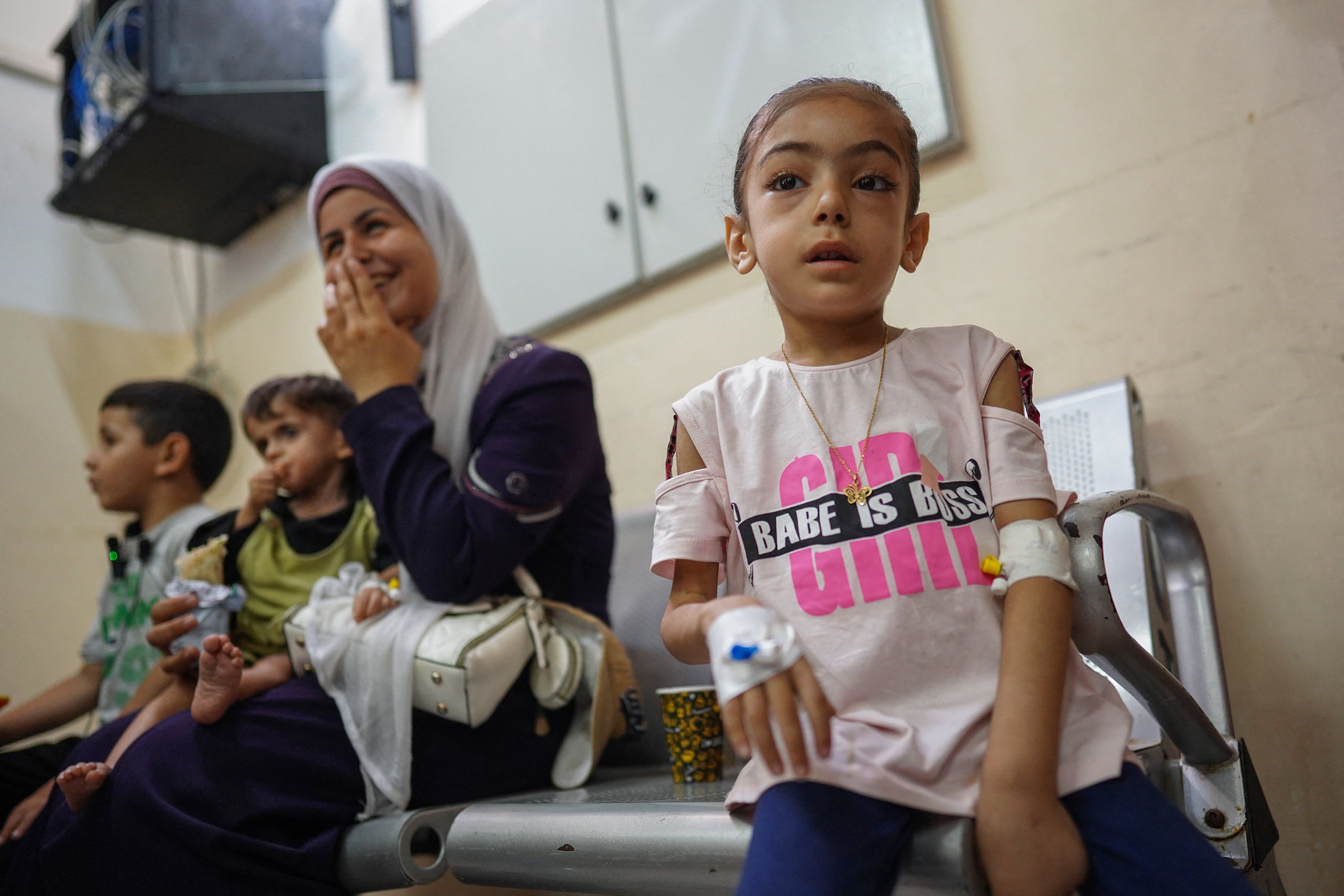 Palestinian children suffering from malnutrition or chronic diseases such as cancer, wait with their family members at Nasser Hospital in Khan Yunis in the southern Gaza Strip after they received permission from the Israeli army to leave the besieged Palestinian territories.