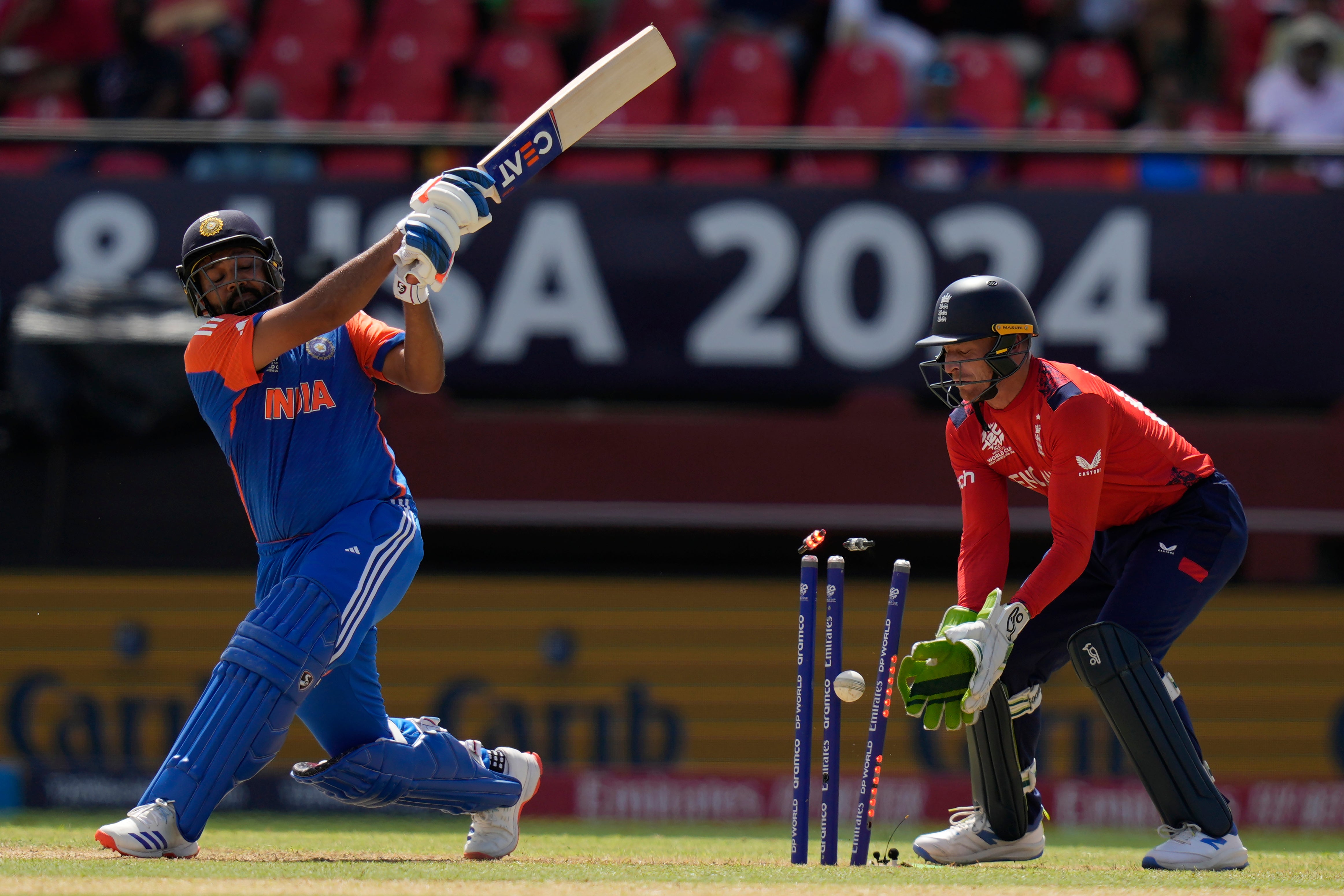 Rohit Sharma is bowled out by Adil Rashid (Ramon Espinosa/AP)