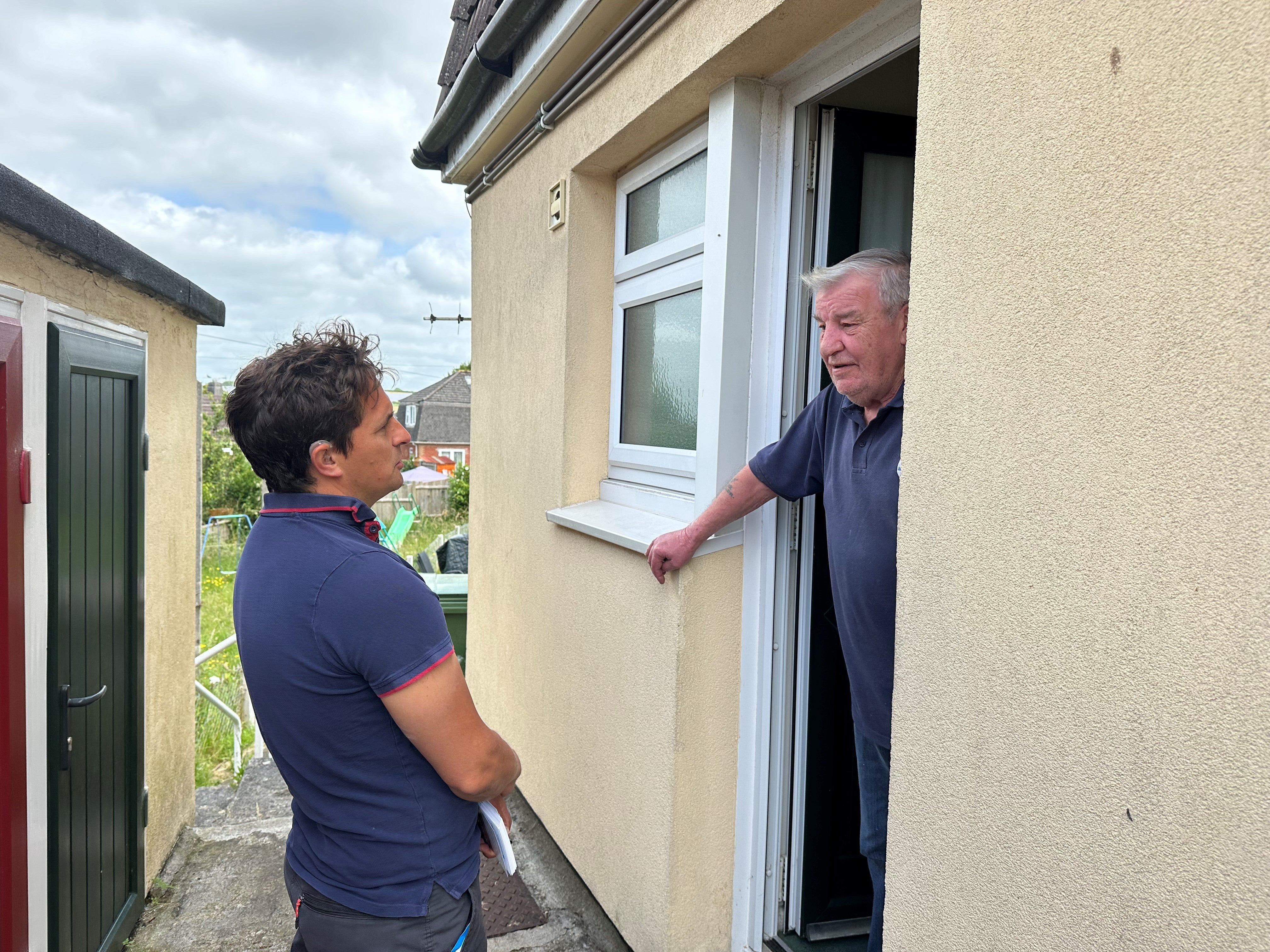Johnny Mercer speaking to a Conservative voter in Ernesettle in Plymouth during canvassing on Thursday