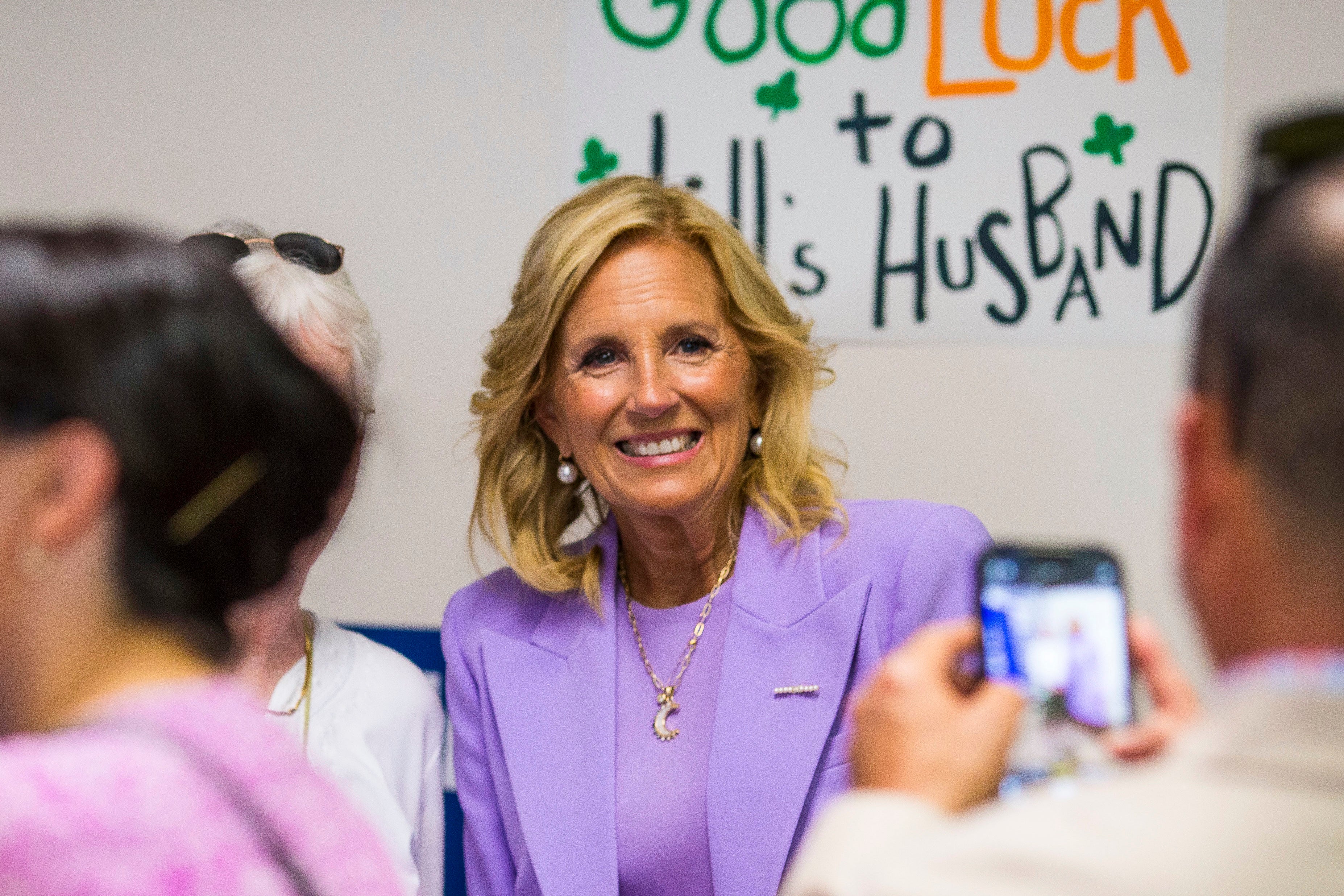 First lady Jill Biden poses for photos with campaign volunteers and supporters at the Virginia Beach Democratic Coordinated Campaign Office on Thursday, June 27, 2024