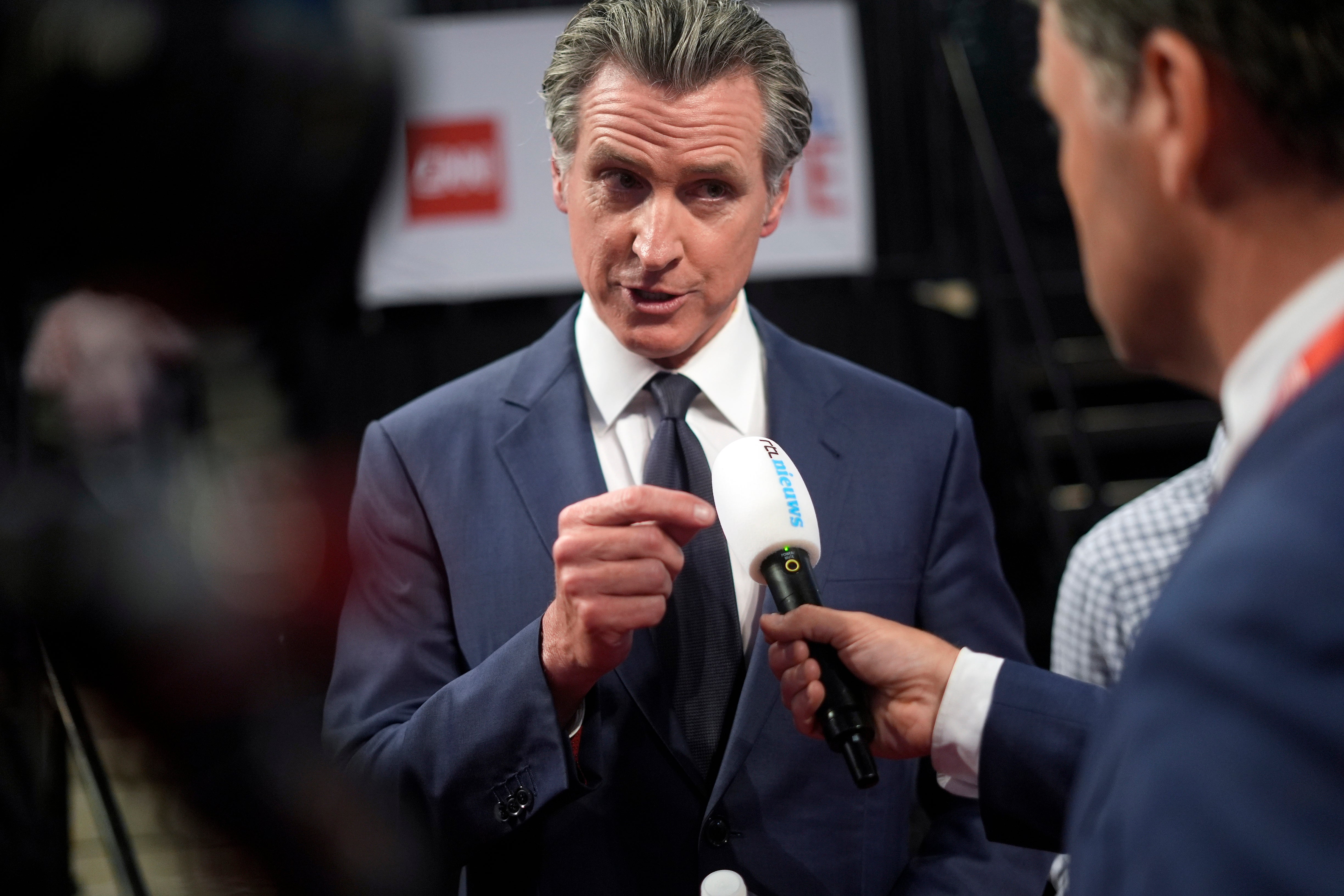 California Governor Gavin Newsom speaks during an interview in the spin room in support of President Joe Biden