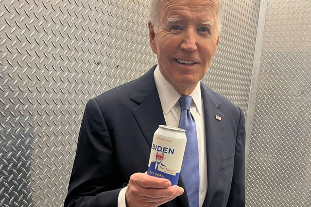 <p>President Joe Biden poses with a can of water on June 27 mocking Donald Trump’s unsubstantiated claims that the president is using performance-enhancing drugs</p>