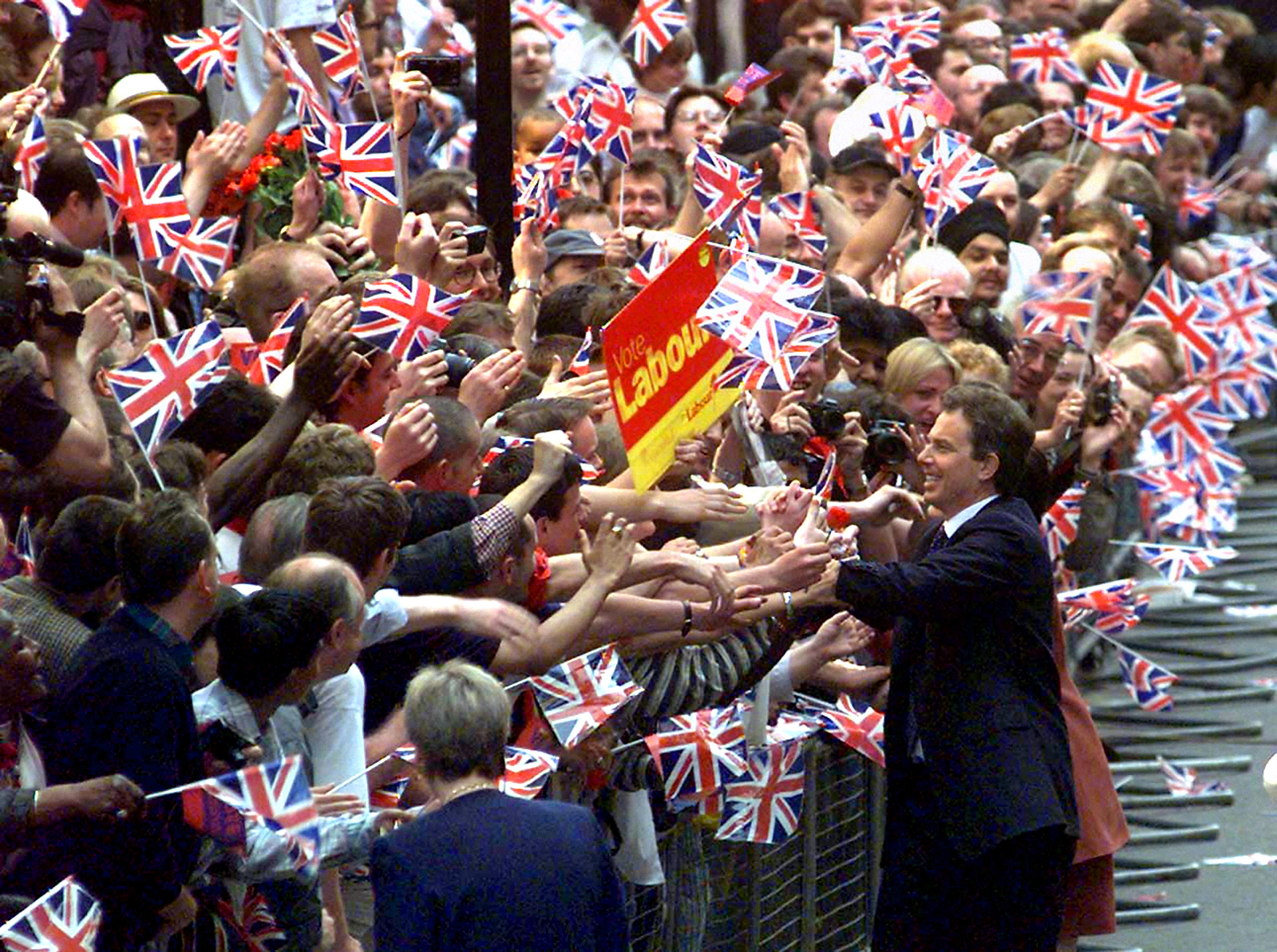 Tony Blair greets hundreds of supporters on his arrival at Downing Street for the first time as prime minister on May 2, 1997 (Adam Butler/PA)