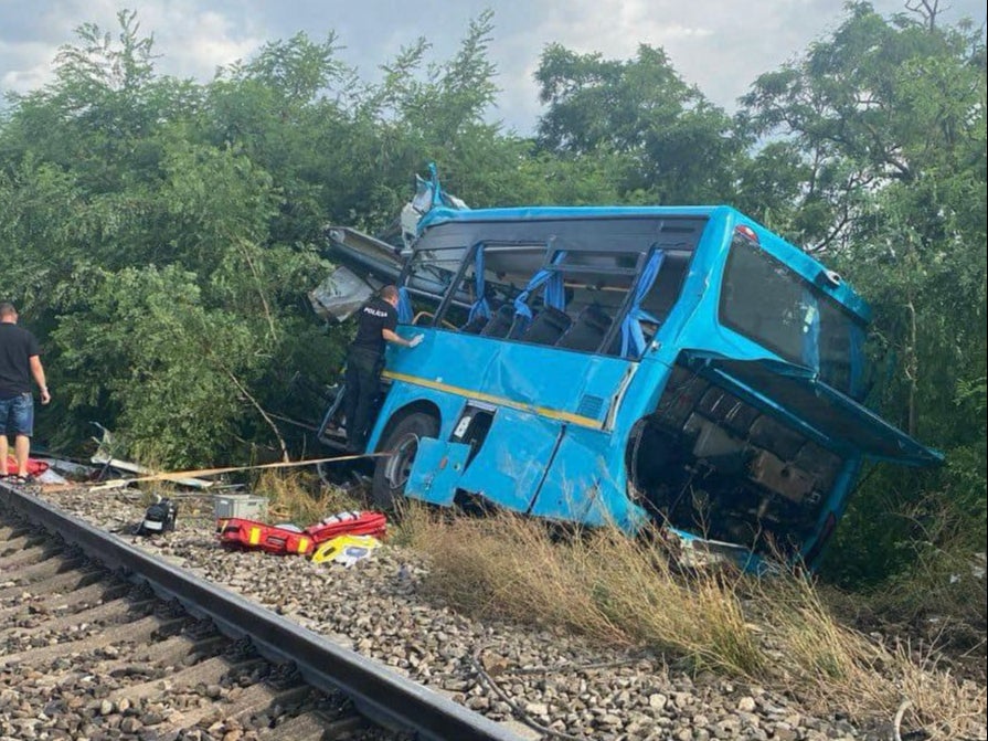 The destroyed bus after it collided with a passenger train in Slovakia