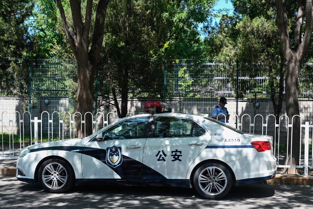<p>A police car is seen outside the Japanese embassy in Beijing </p>