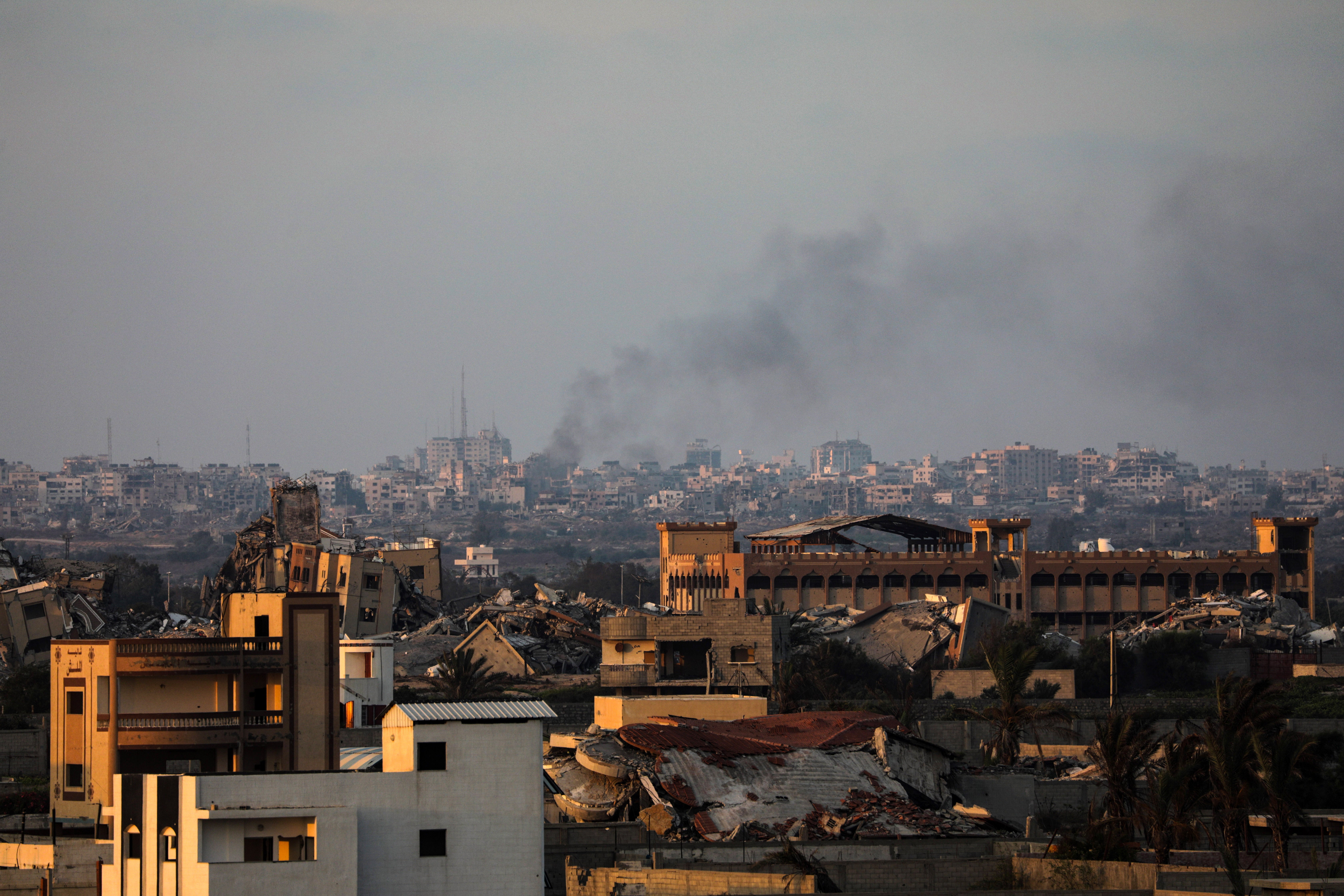 Smoke rises following an Israeli air strike in the east of Gaza City this morning