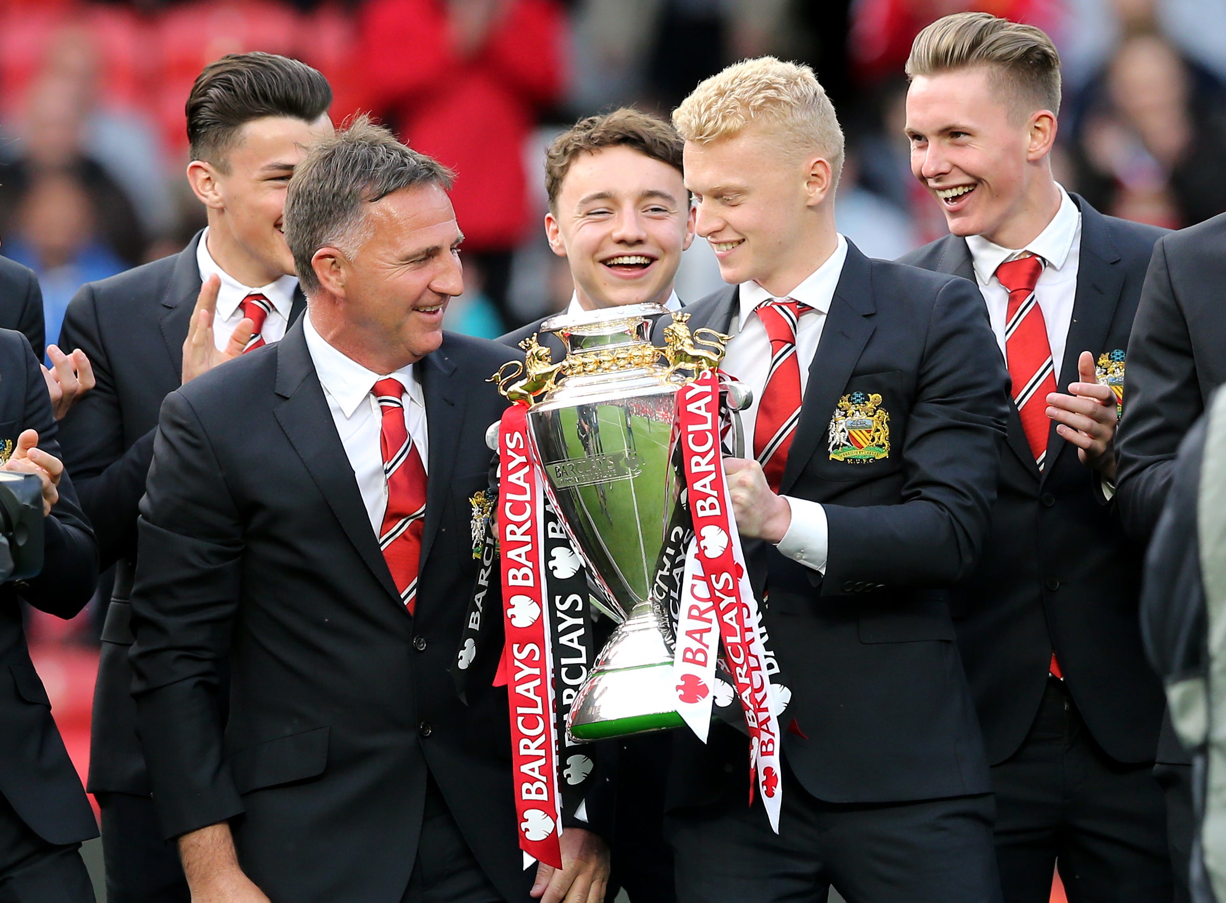 Manchester United Under-21s captain James Weir holds the U21 Premier League trophy at Old Trafford in 2016 (Martin Rickett/PA)