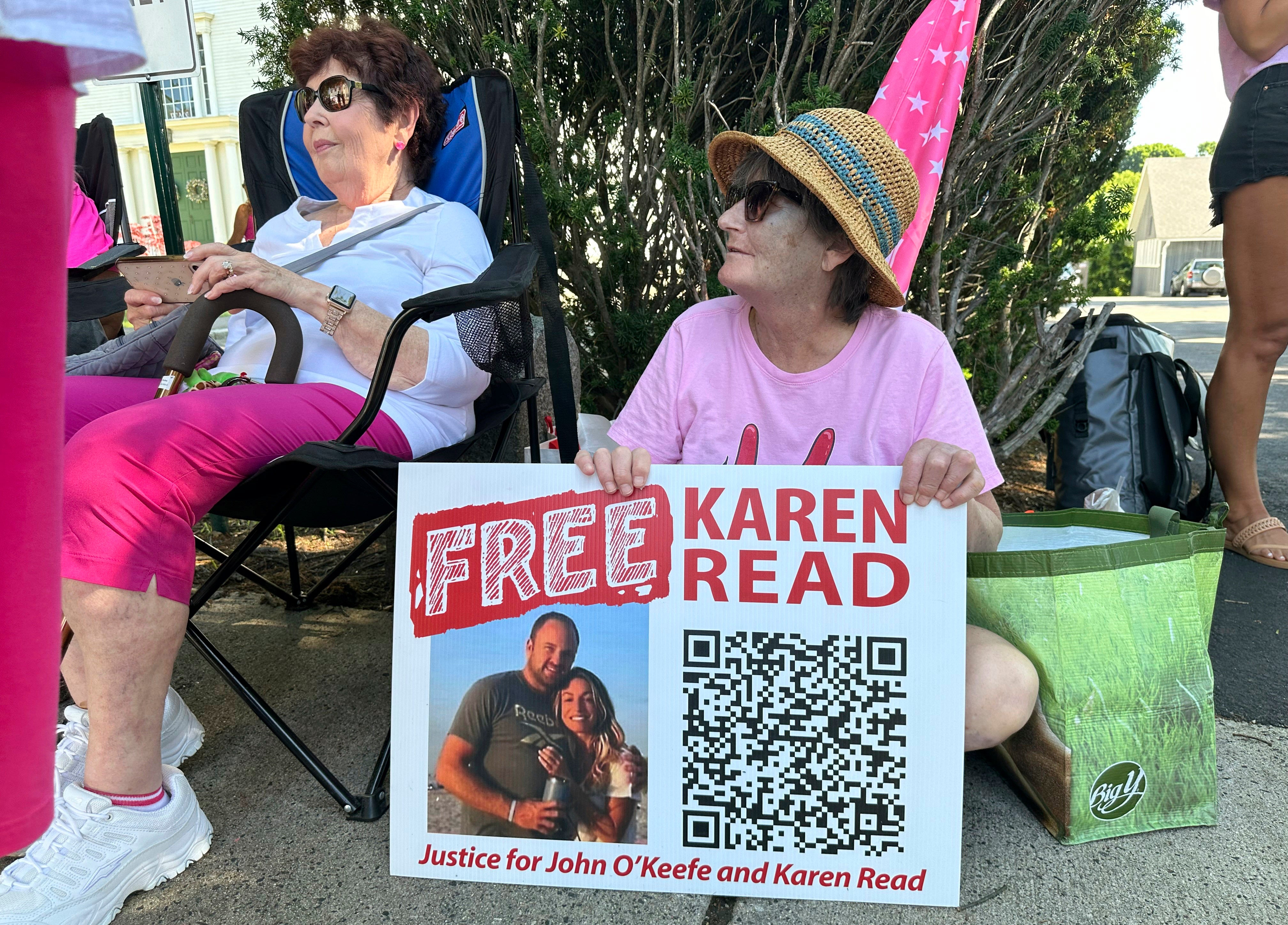 Supporters of Karen Read display signs at Norfolk Superior Court