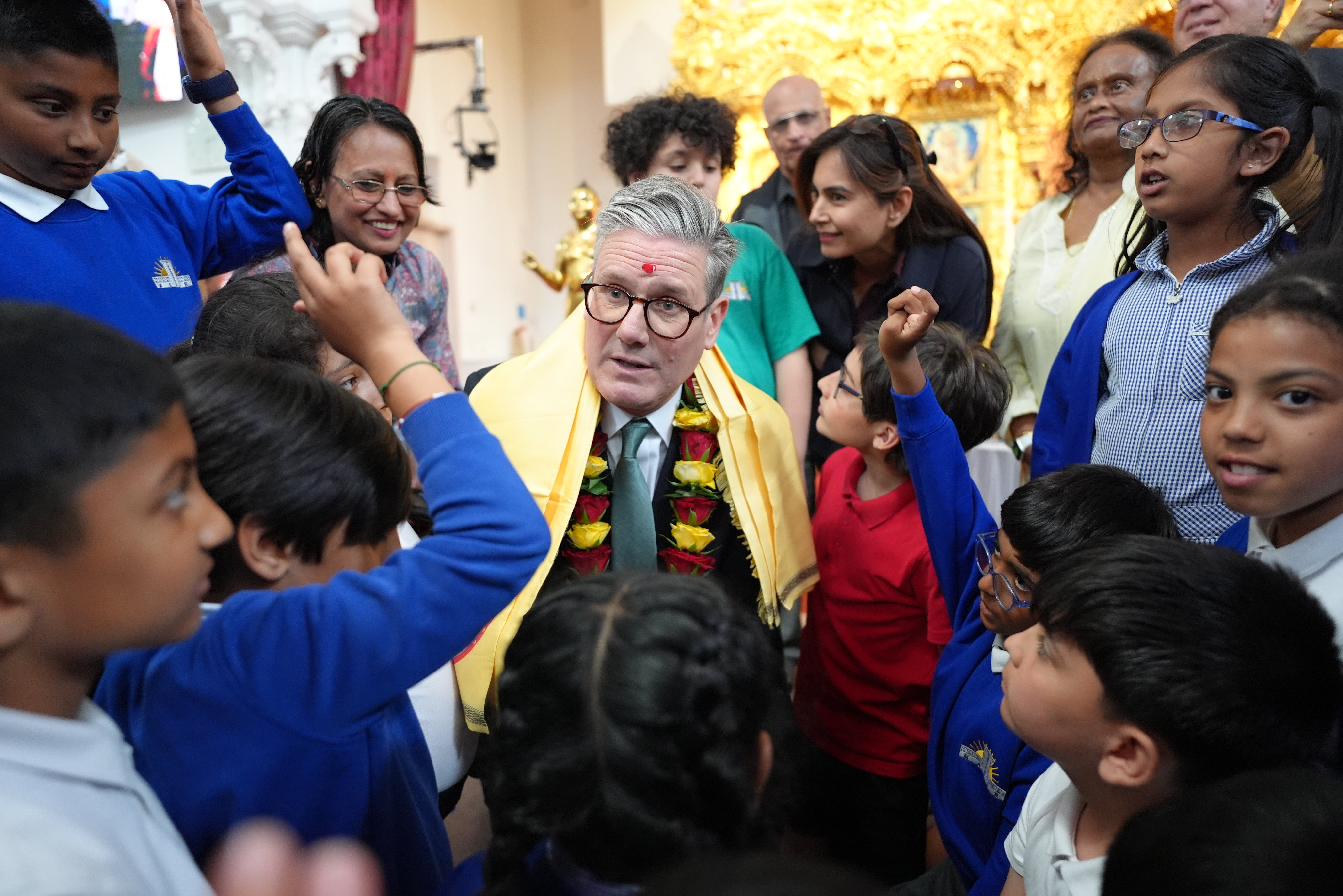 A group of school children then took it in turns to question Sir Keir (Stefan Rousseau/PA)