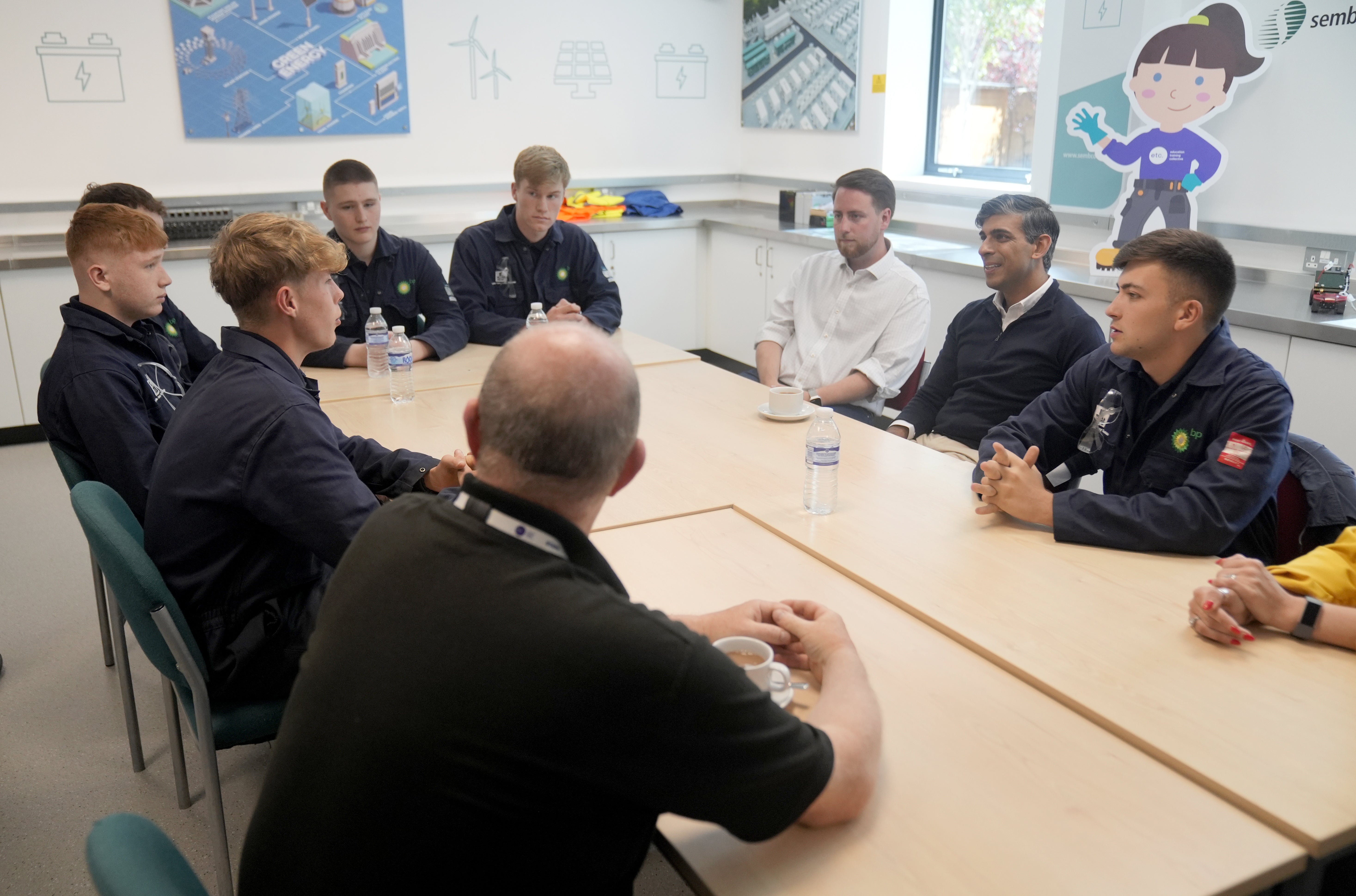 Mr Sunak sat down with several of the engineering apprentices and listened to their hopes for the next government (Danny Lawson/PA)