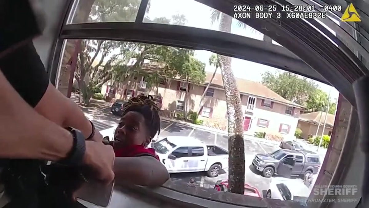 Florida woman dangles from window in attempt to flee police