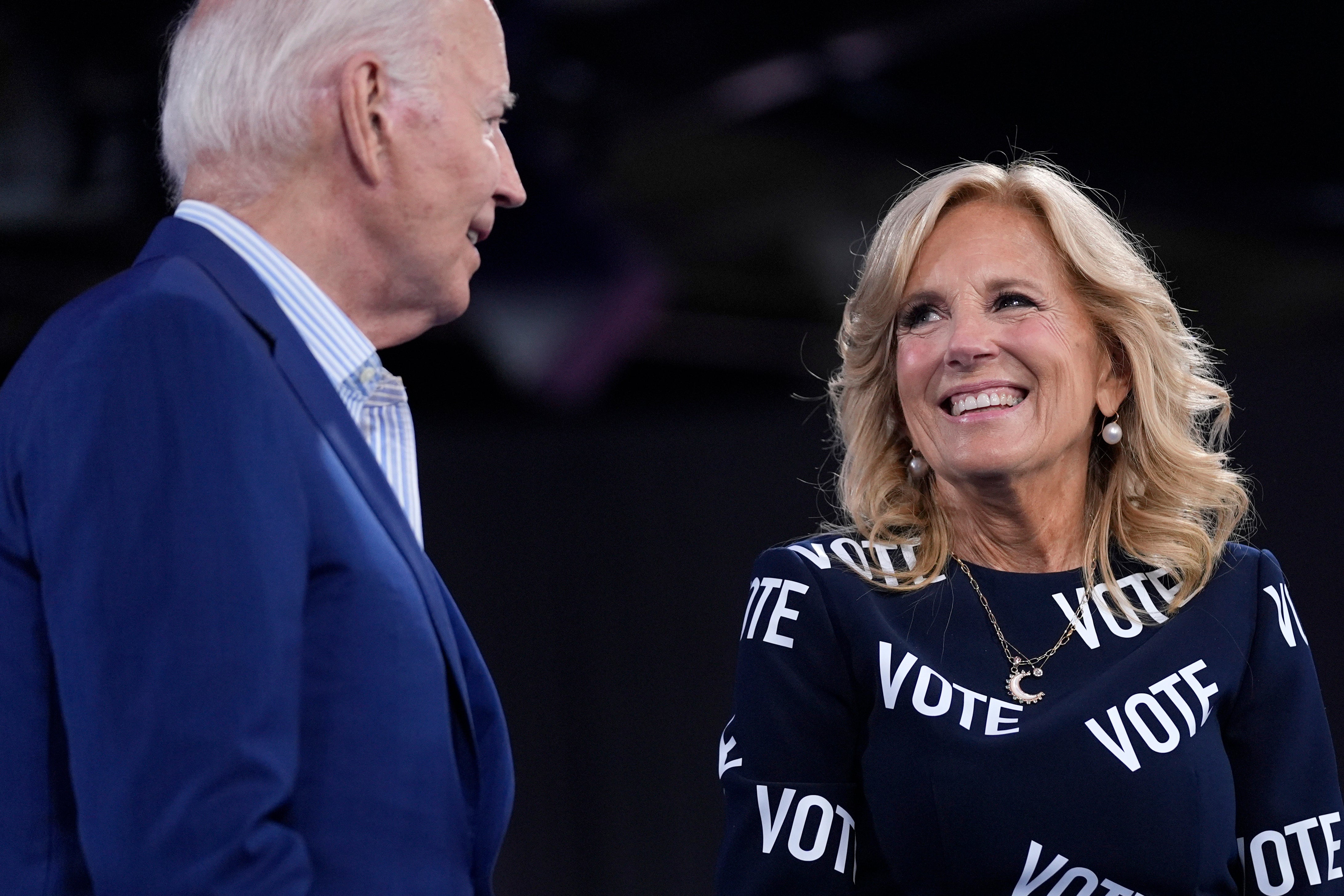 President Joe Biden, left, and first lady Jill Biden appear on stage at a campaign rally, Friday, June 28, 2024