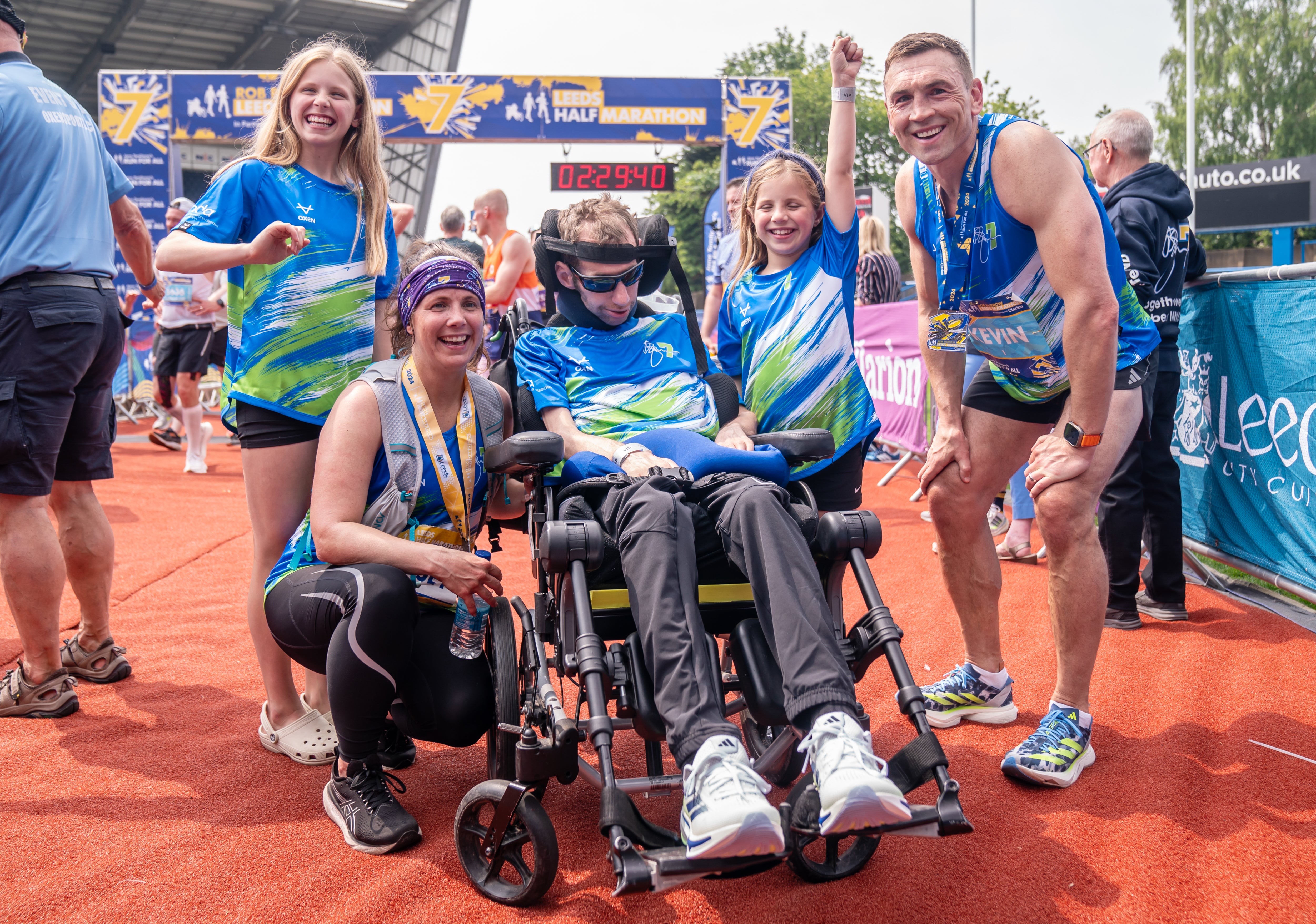 Burrow, pictured alongside wife Lindsey, daughters Macy and Maya, and Kevin Sinfield at the Leeds Marathon in May (Danny Lawson/PA)