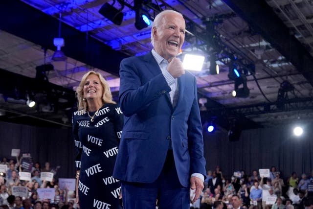 <p>President Joe Biden and first lady Jill Biden walk off stage after speaking at a campaign rally on June 28. </p>